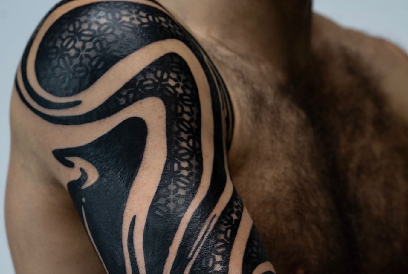 Tribal design tribal tattoo on the upper arm by Josaline Green