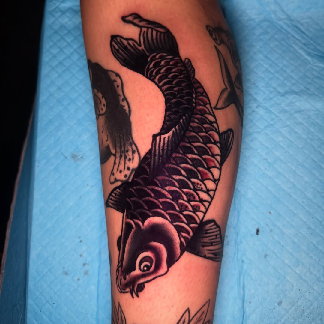 Koi fish American traditional tattoo on the forearm by Arron Albaugh