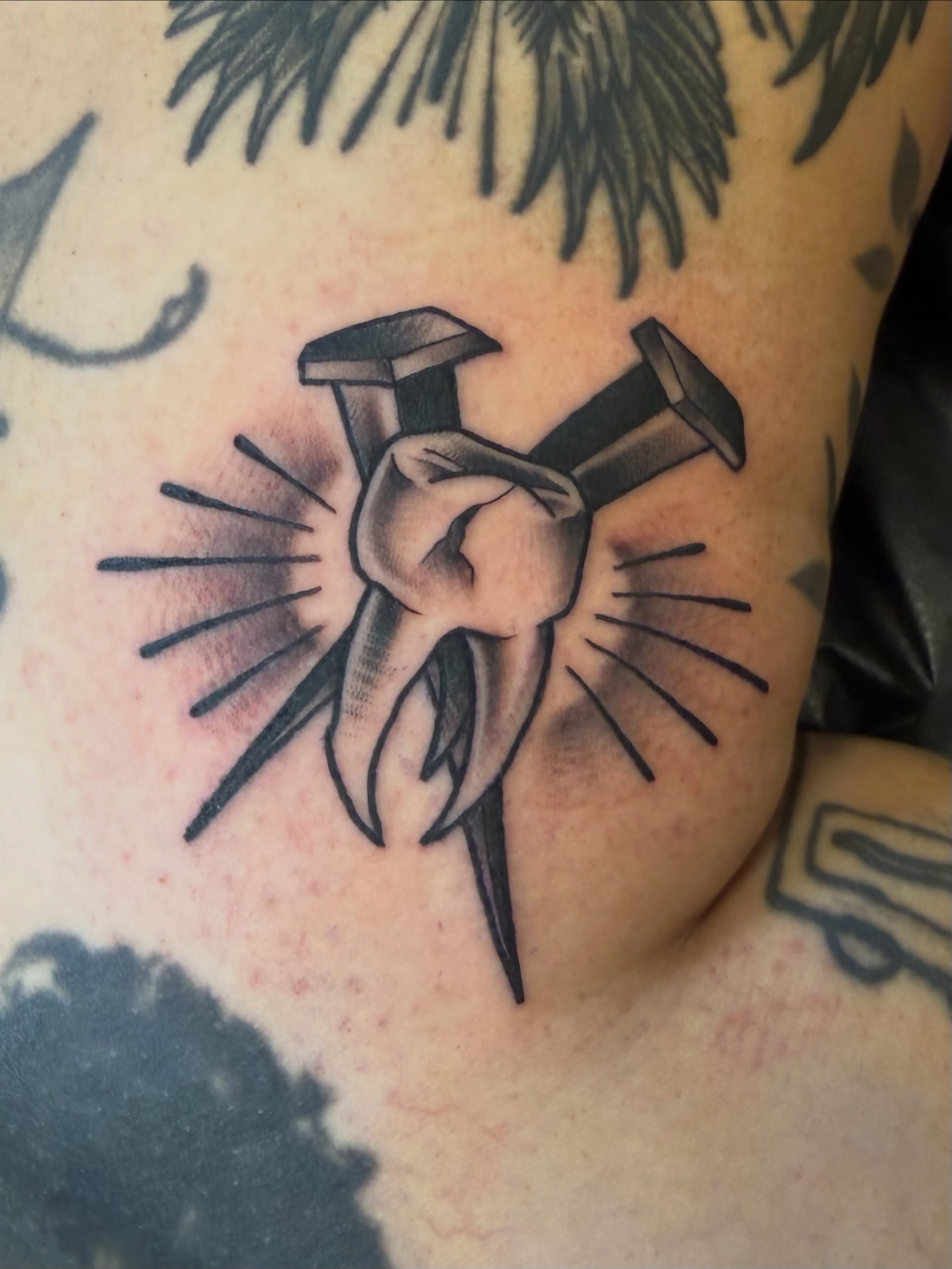 Hammer and fist black and grey tattoo on the chest by Dee - MA Tattoo Artist, Concord, Massachusetts
