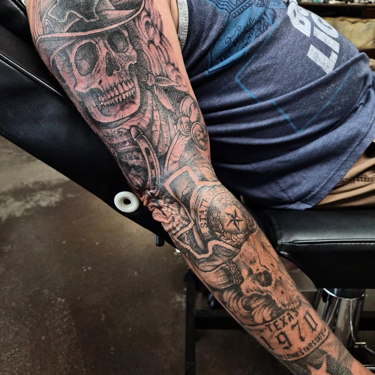 Motorcycle rider with skull American traditional tattoo on the forearm by Taylor Popkins