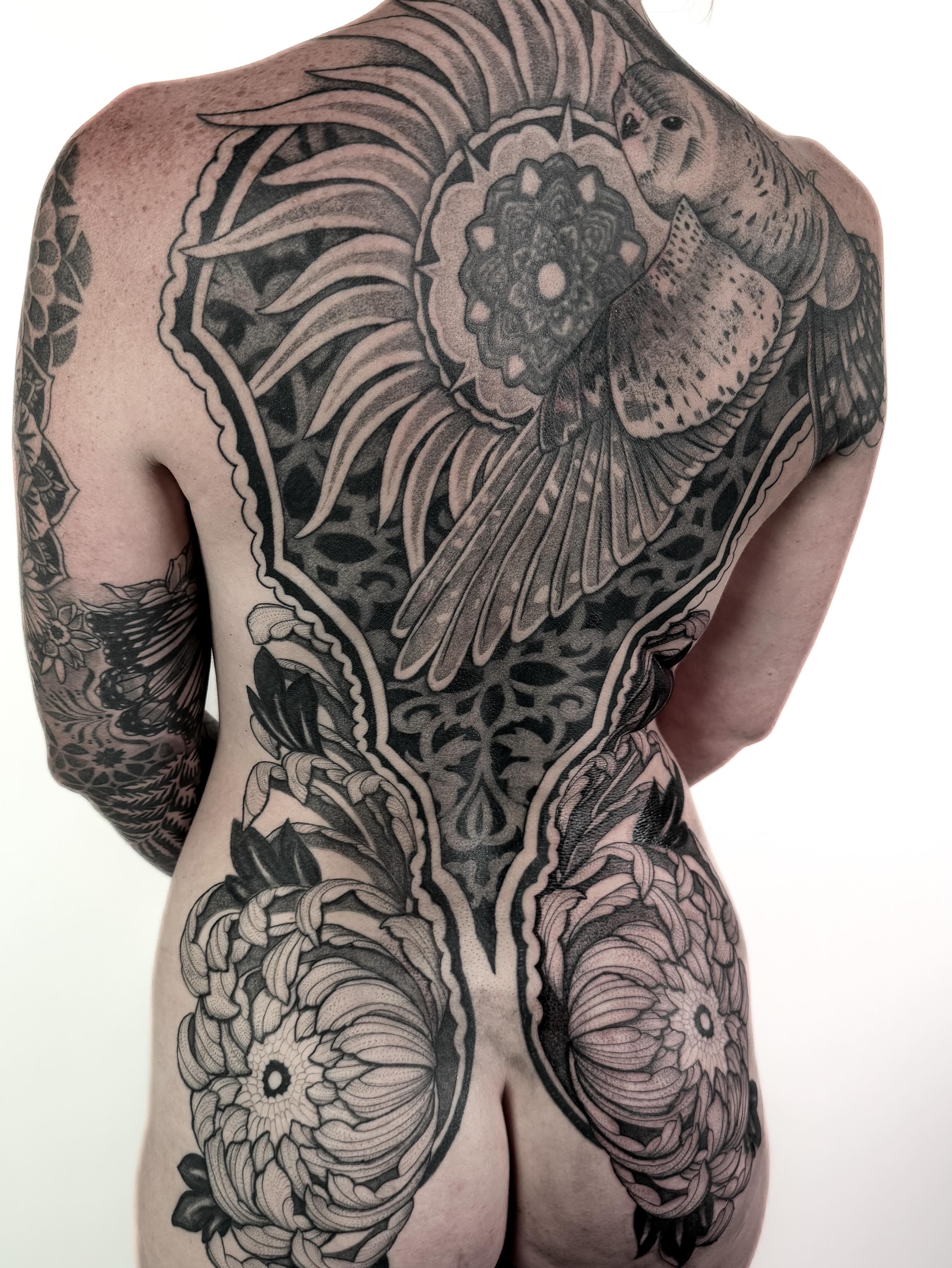 Bird and floral geometric tattoo on the back by Jamie Beach, Wheat Ridge, Colorado
