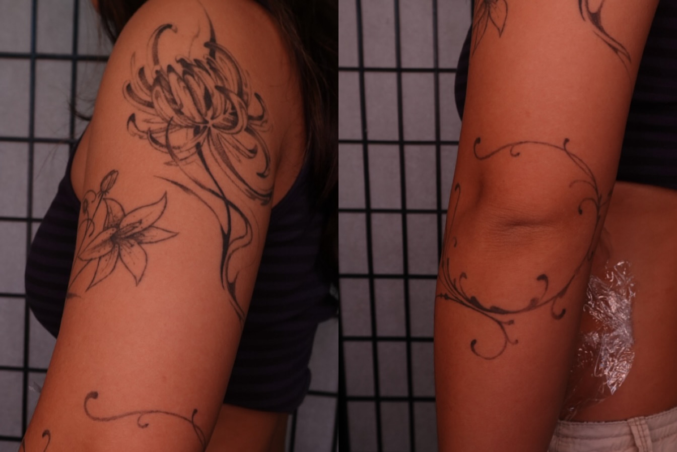 Floral design black and grey tattoo on the upper arm by jun