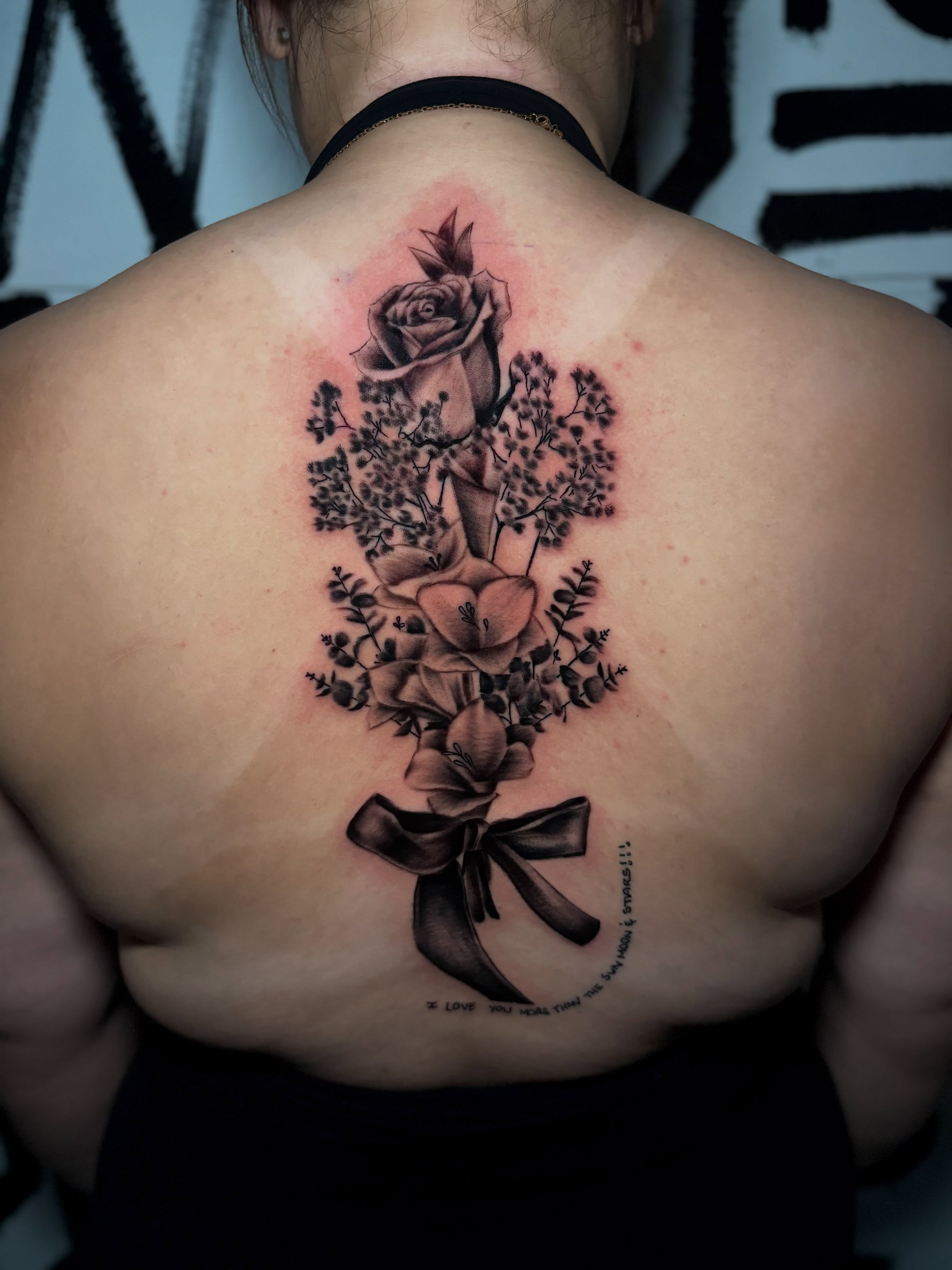 Flower bouquet realism tattoo on the back by Lee