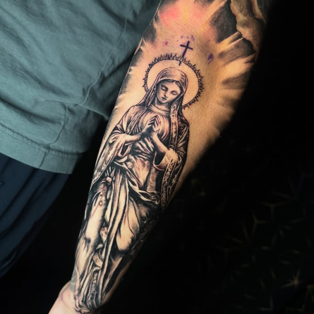 Religious figure black and grey tattoo on the forearm by Benzo