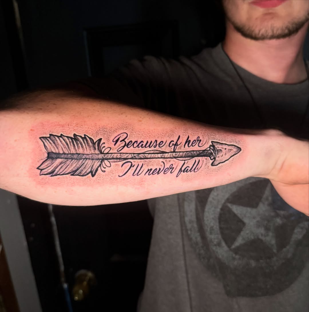 Arrow with quote dotwork tattoo on the forearm by Alex Wheelock