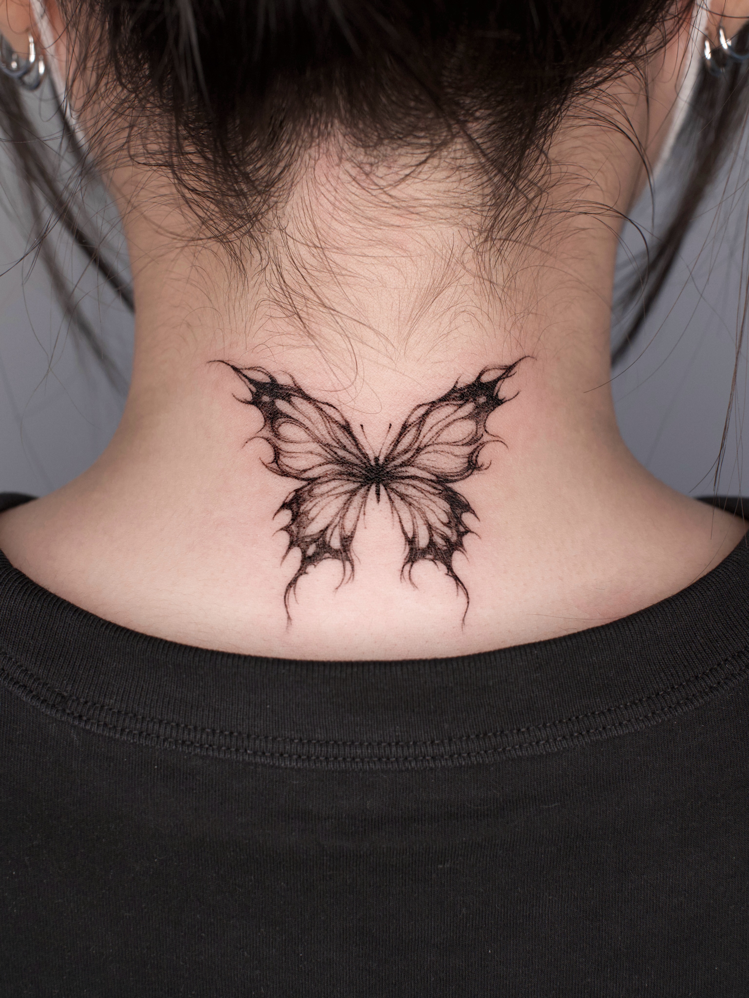 Butterfly black and grey tattoo on the neck by @tattoo_chamsae