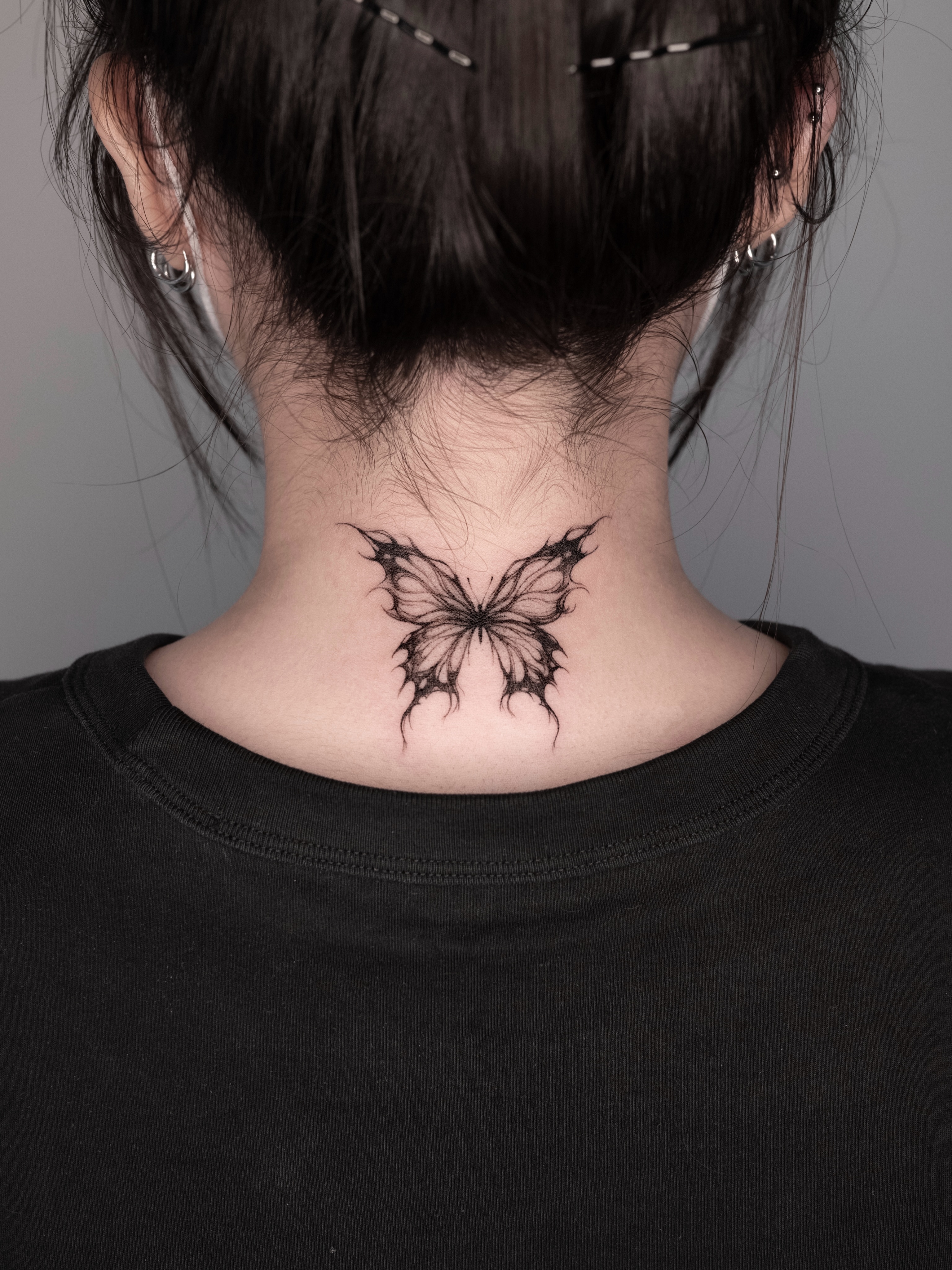 Butterfly black and grey tattoo on the neck by @tattoo_chamsae