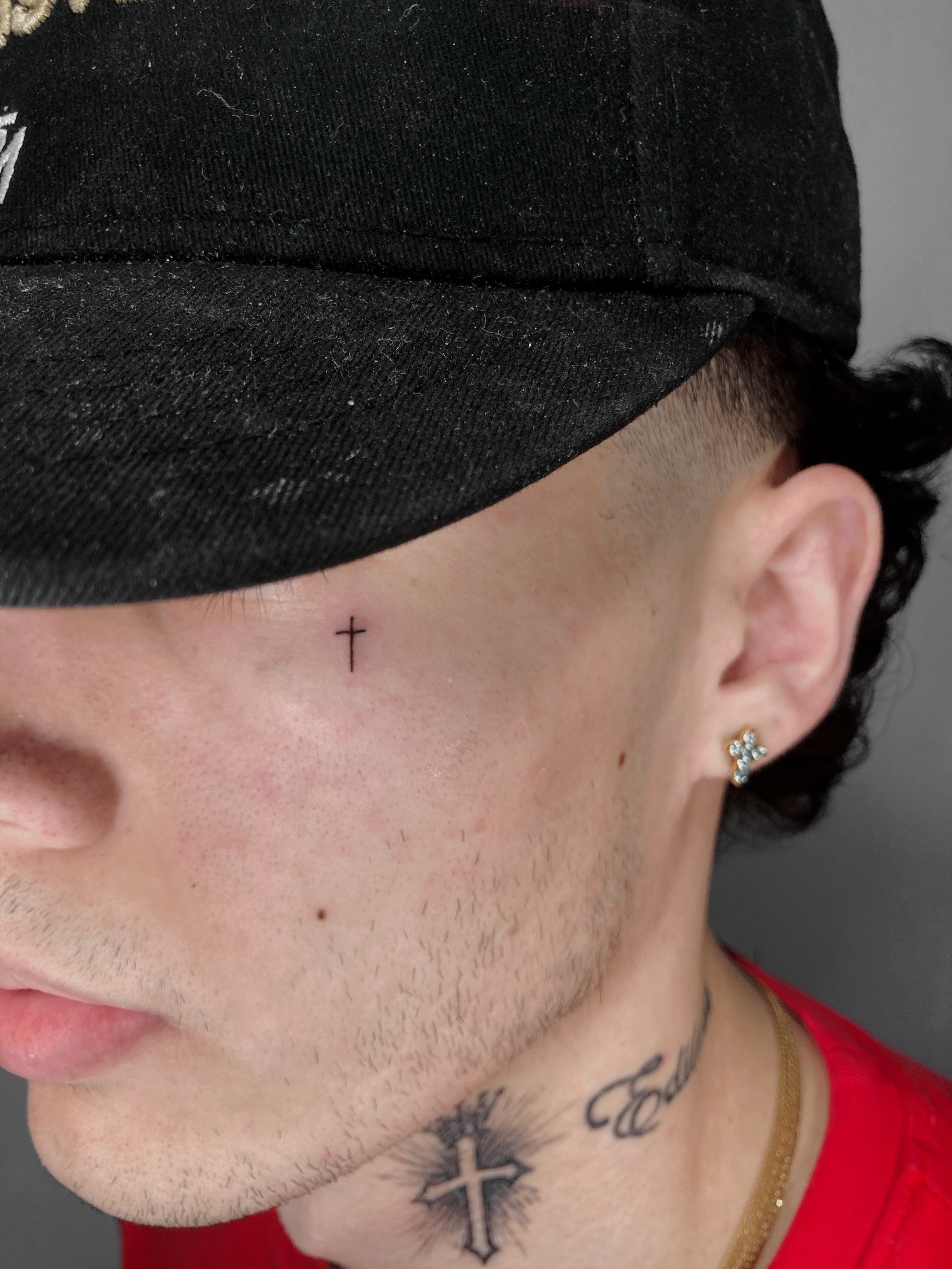 Cross black and grey tattoo on the neck by Alvaro
