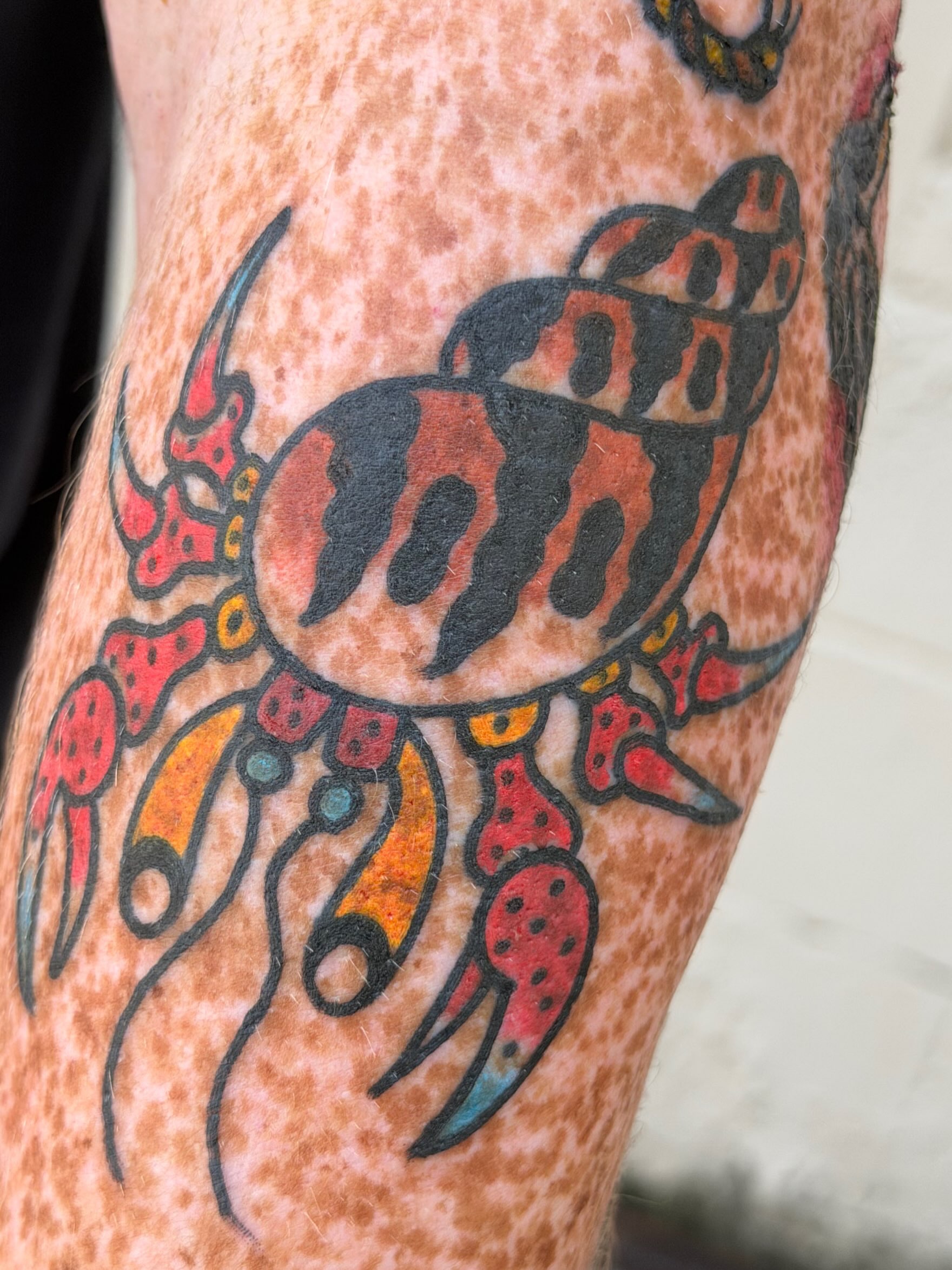 Crab trash polka tattoo on the forearm by dave rash