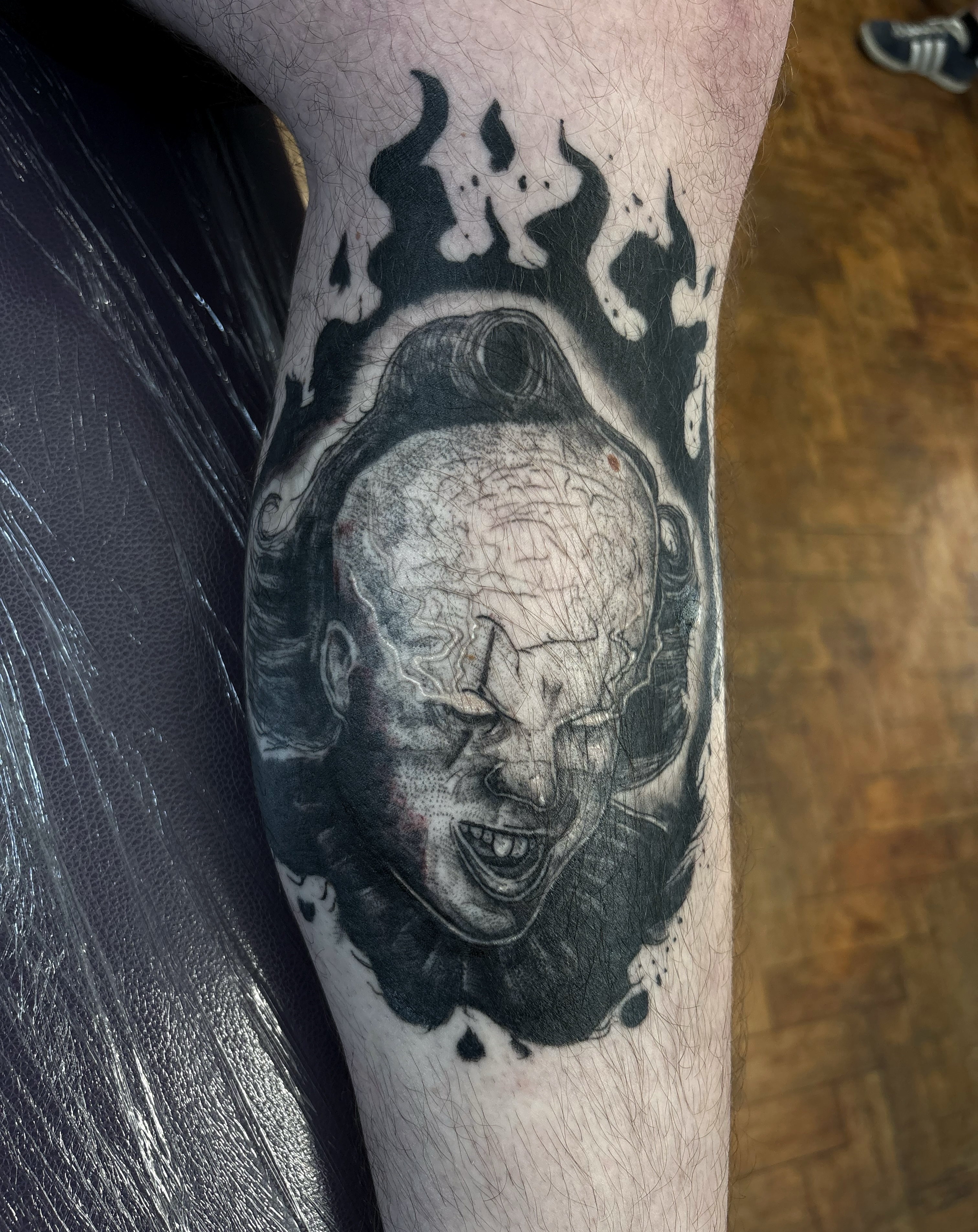 Tattoo by @scorchedbones_ — black_and_grey, realism