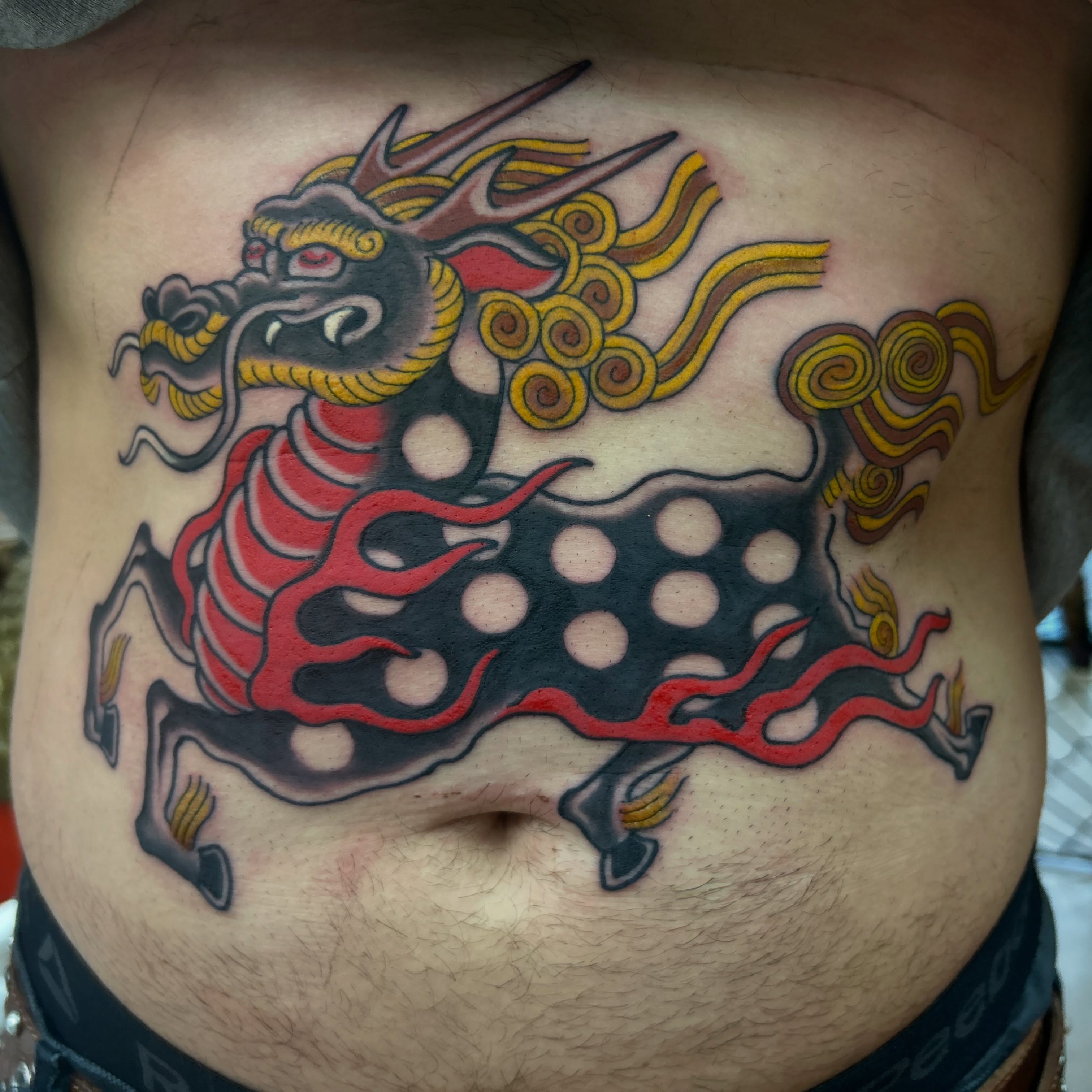 Mythical creature American traditional tattoo on the ribs by Katie Dexter, Des Moines, Iowa