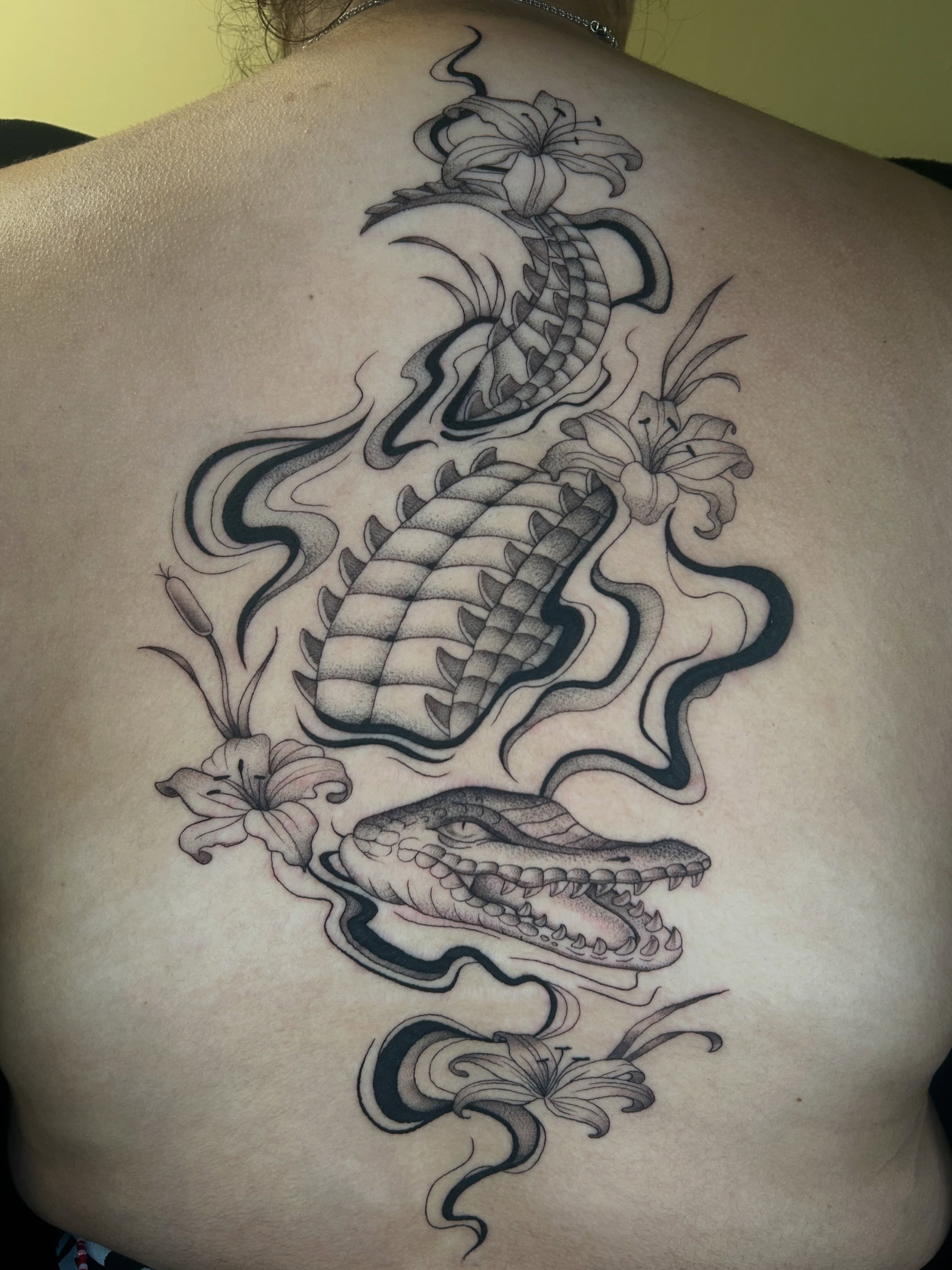 Alligator and dragon dotwork tattoo on the back by Cassy D, Miami, Florida
