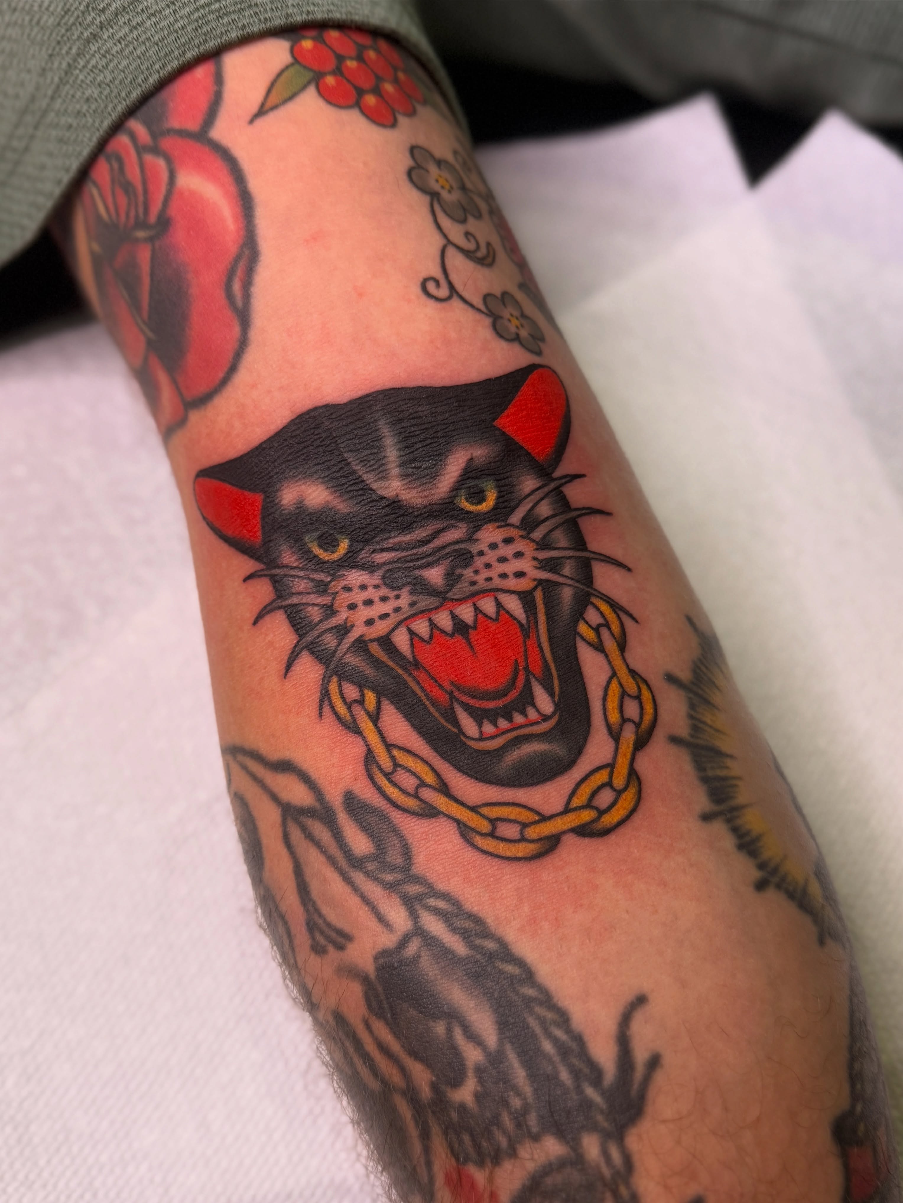 Panther head American traditional tattoo on the forearm by Ethan, Toledo, Ohio