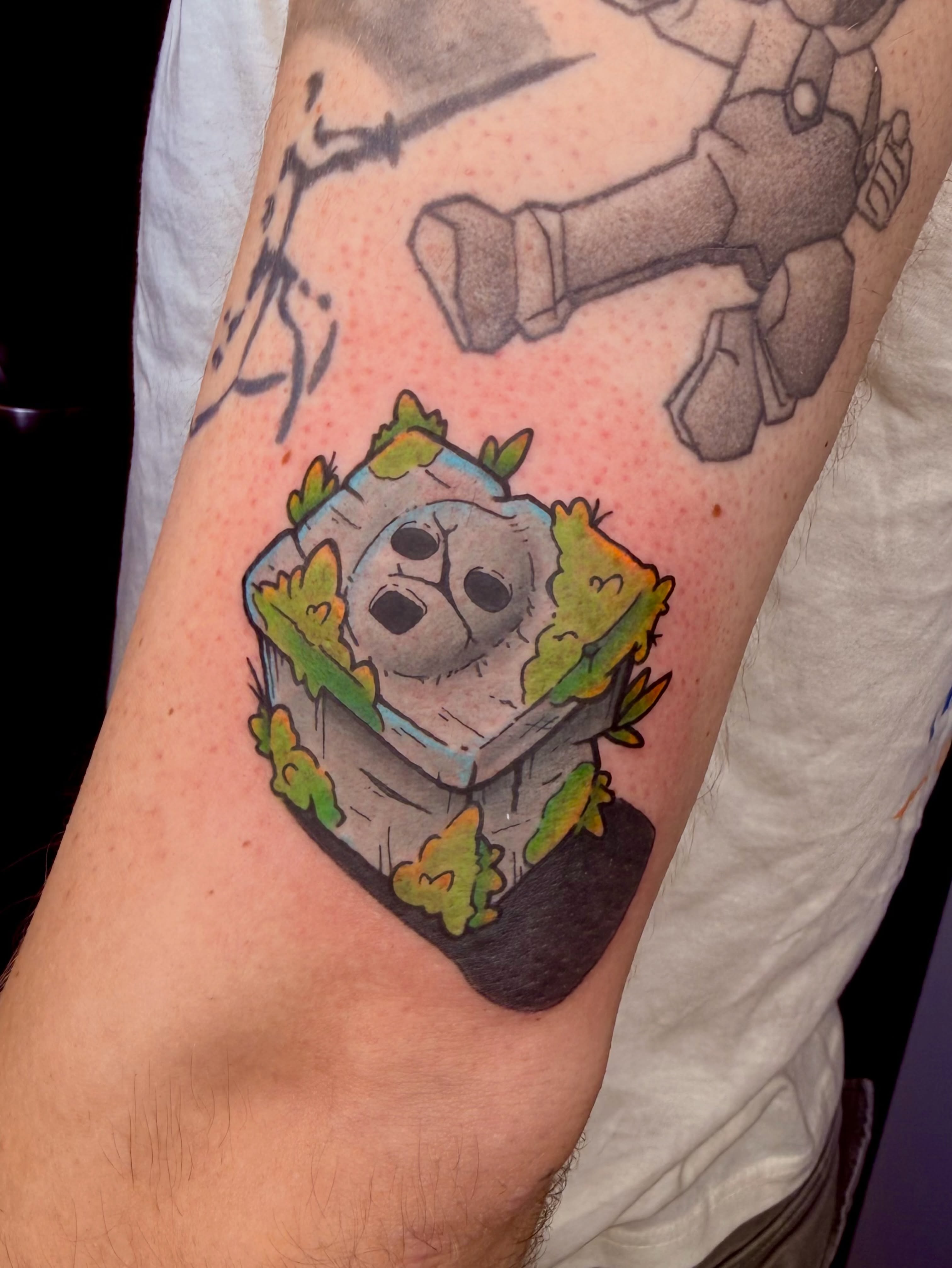 Stone block with plant dotwork tattoo on the forearm by Jezza Munson