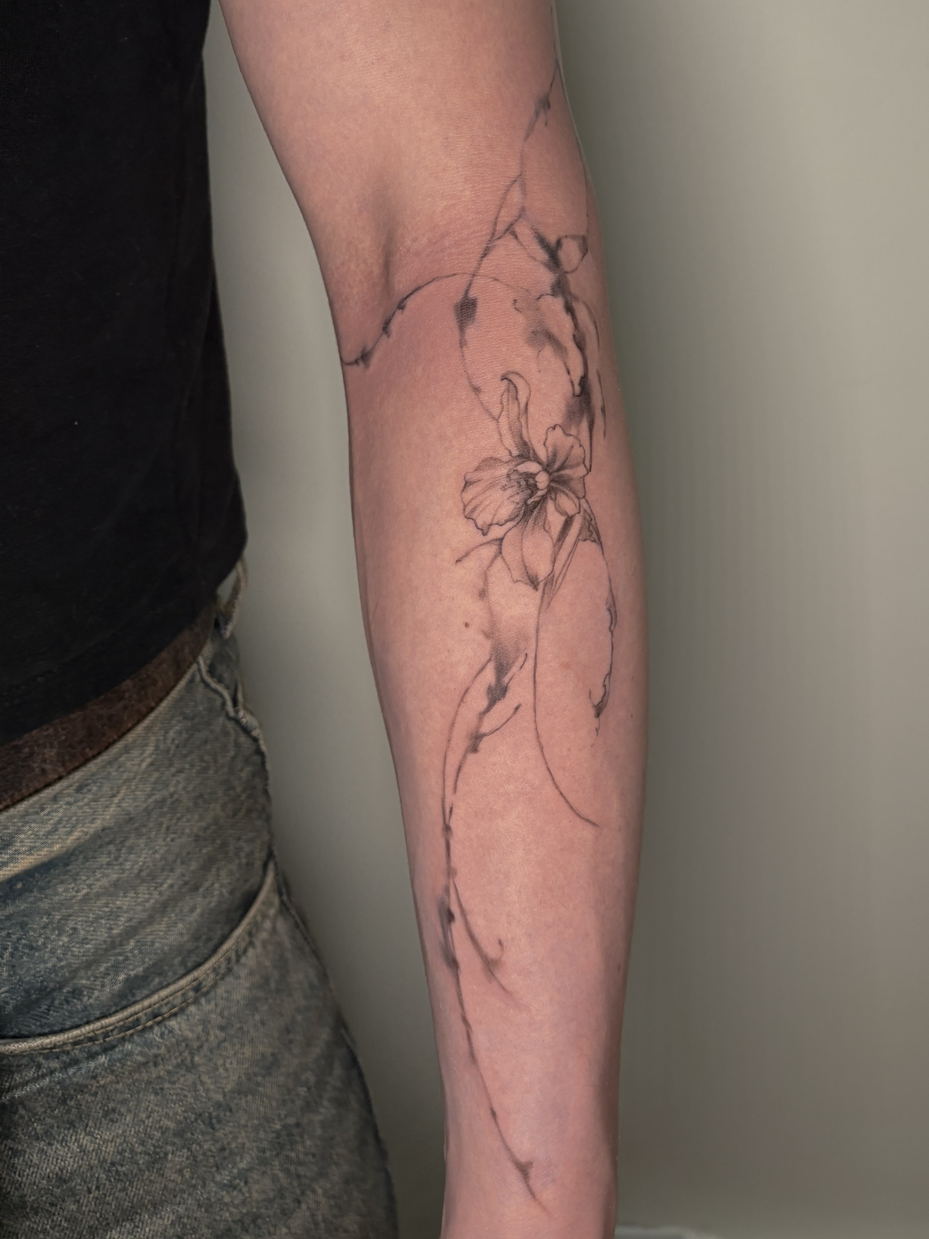 Flower black and grey tattoo on the forearm by Jinz