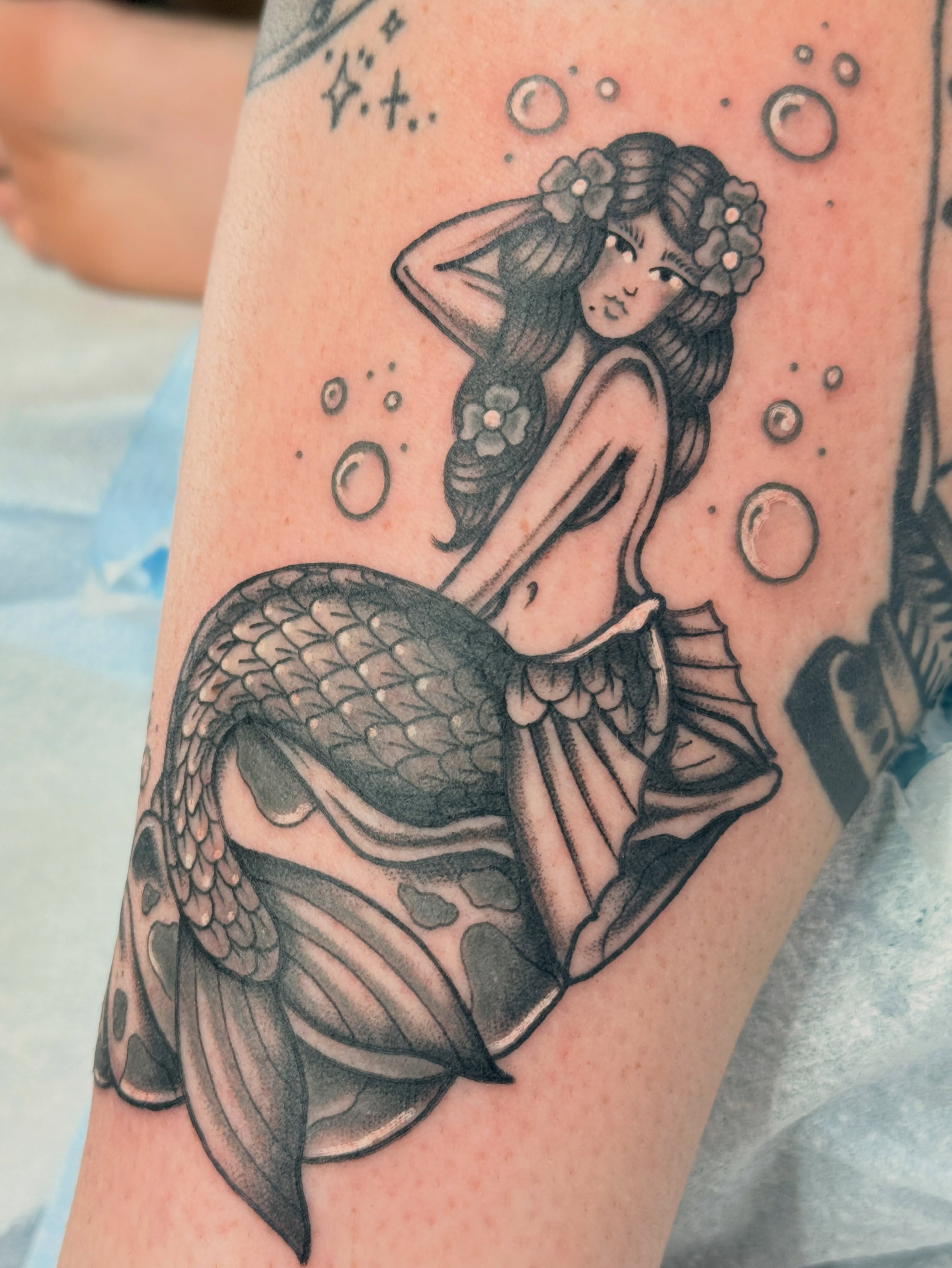 Mermaid American traditional tattoo on the forearm by Megan Sue Causemaker