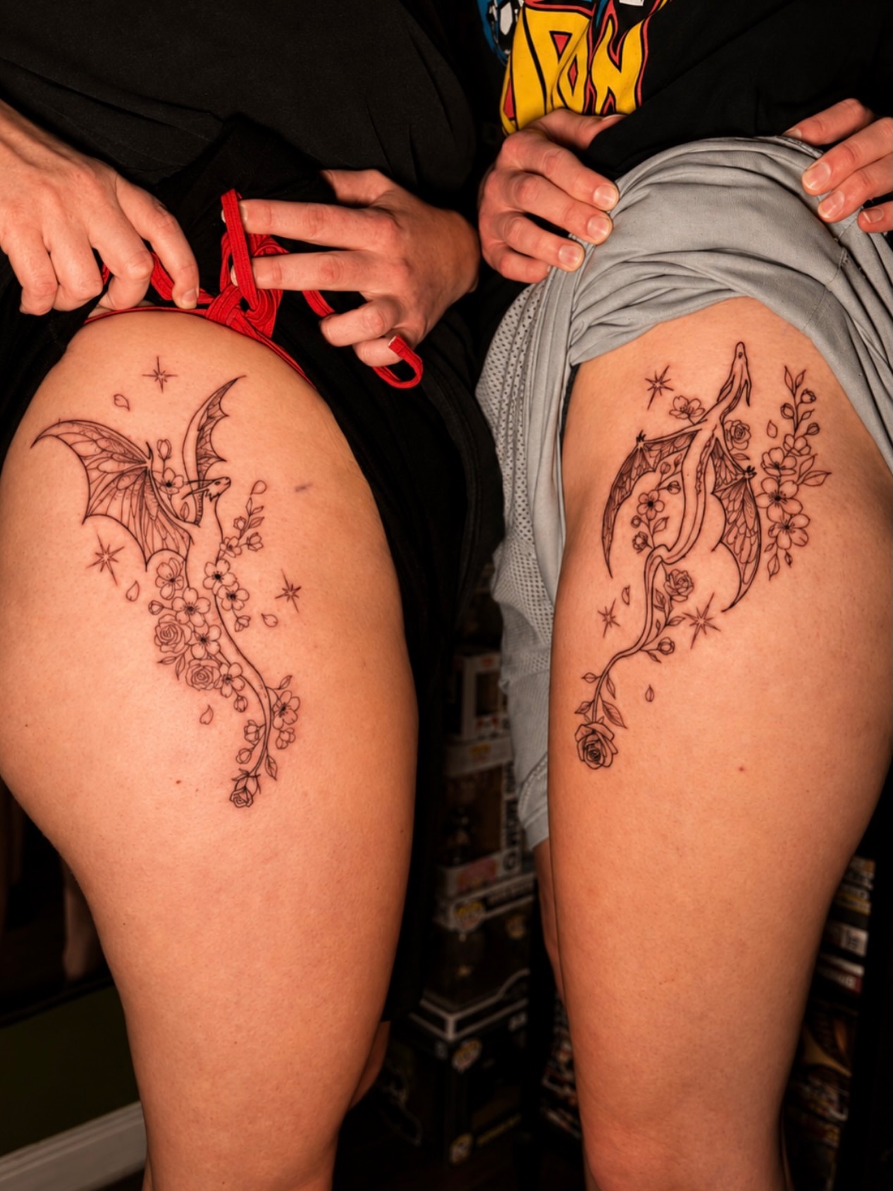 Bat and cherry blossoms black and grey tattoo on the thigh by Messias Tattoo Artist