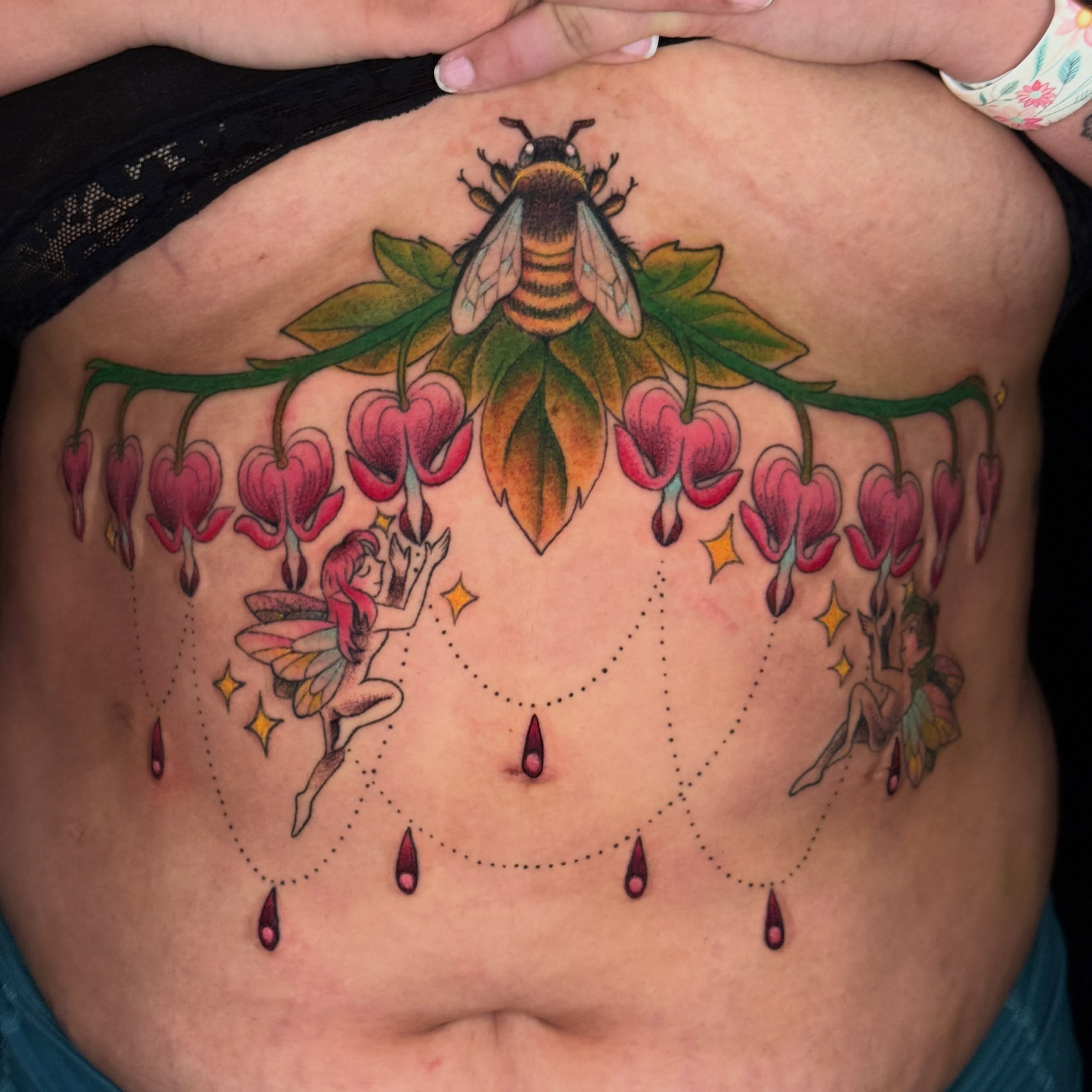 Bee and bleeding heart flowers new school tattoo on the ribs by liam u. williams