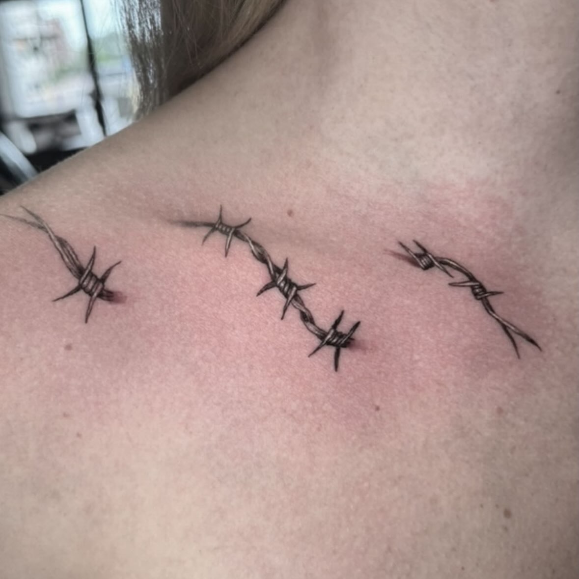 Barbed wire black and grey tattoo on the shoulder by Mtctattoos