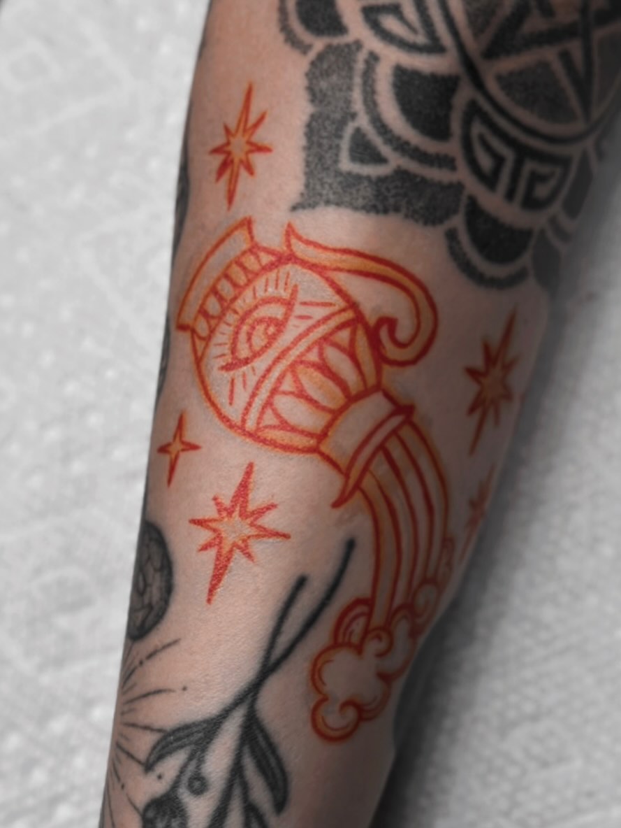 Astronaut with stars American traditional tattoo on the forearm by Kat Fishbein