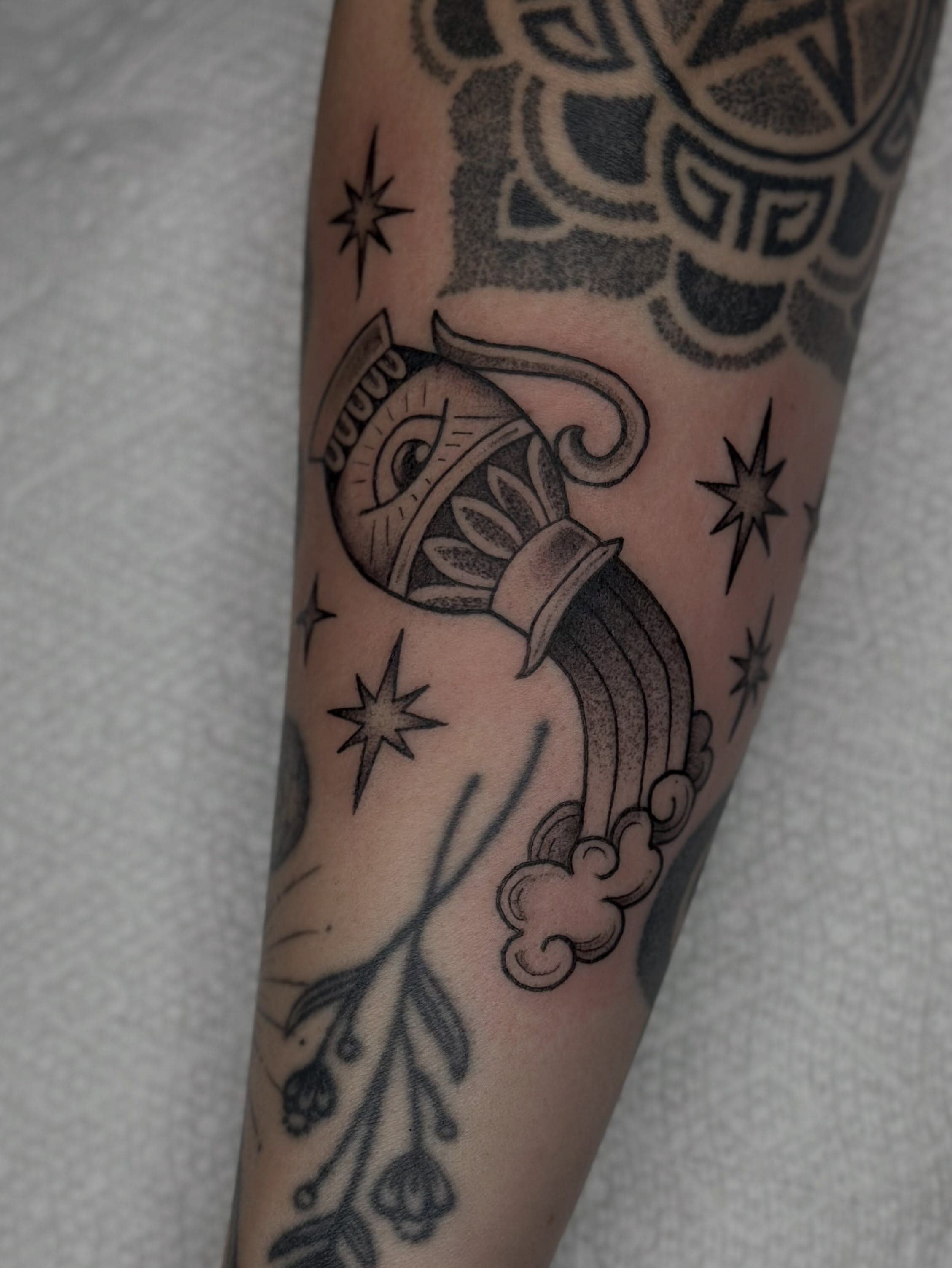 Torch and stars American traditional tattoo on the forearm by Kat Fishbein