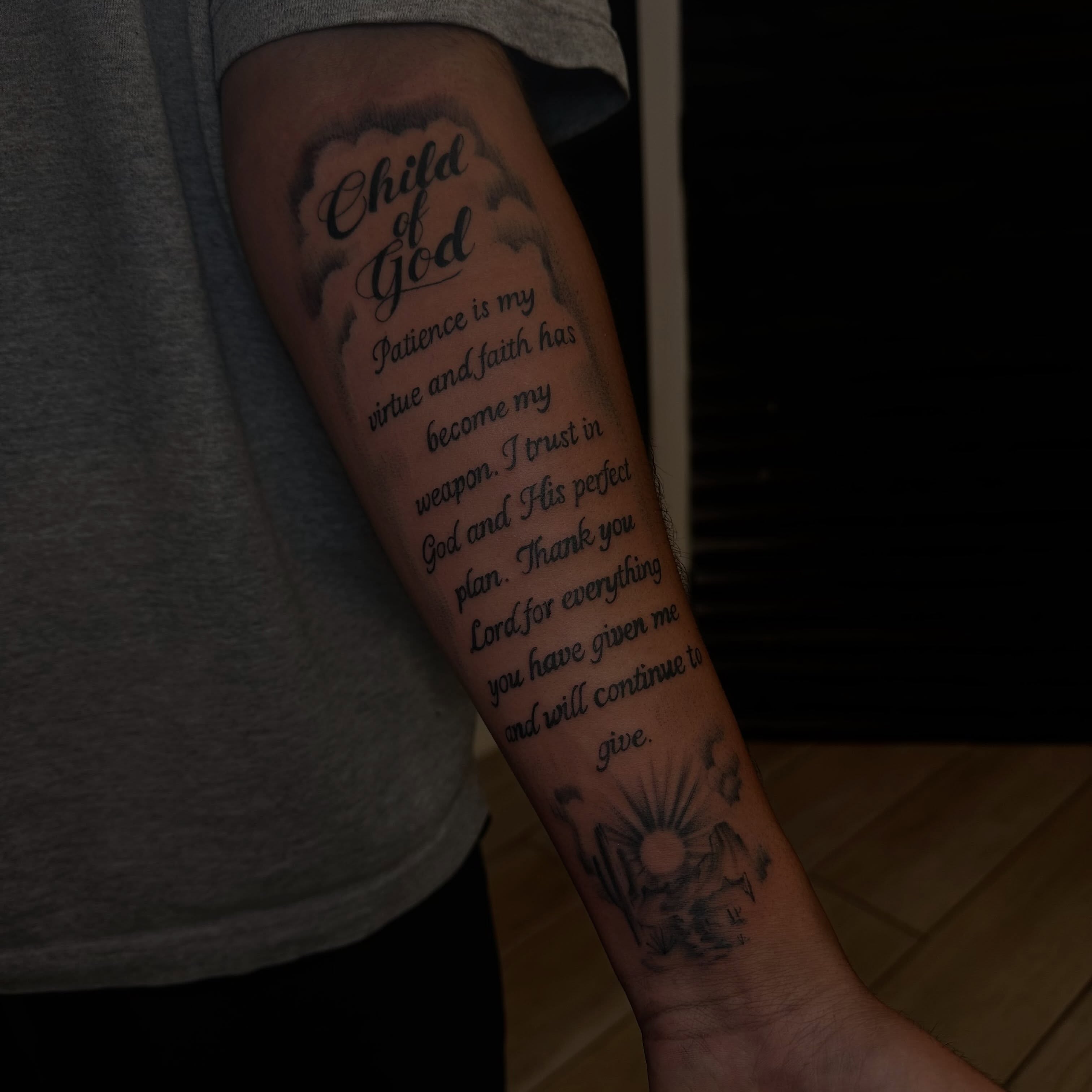 Religious message lettering script tattoo on the forearm by Marly Quinn