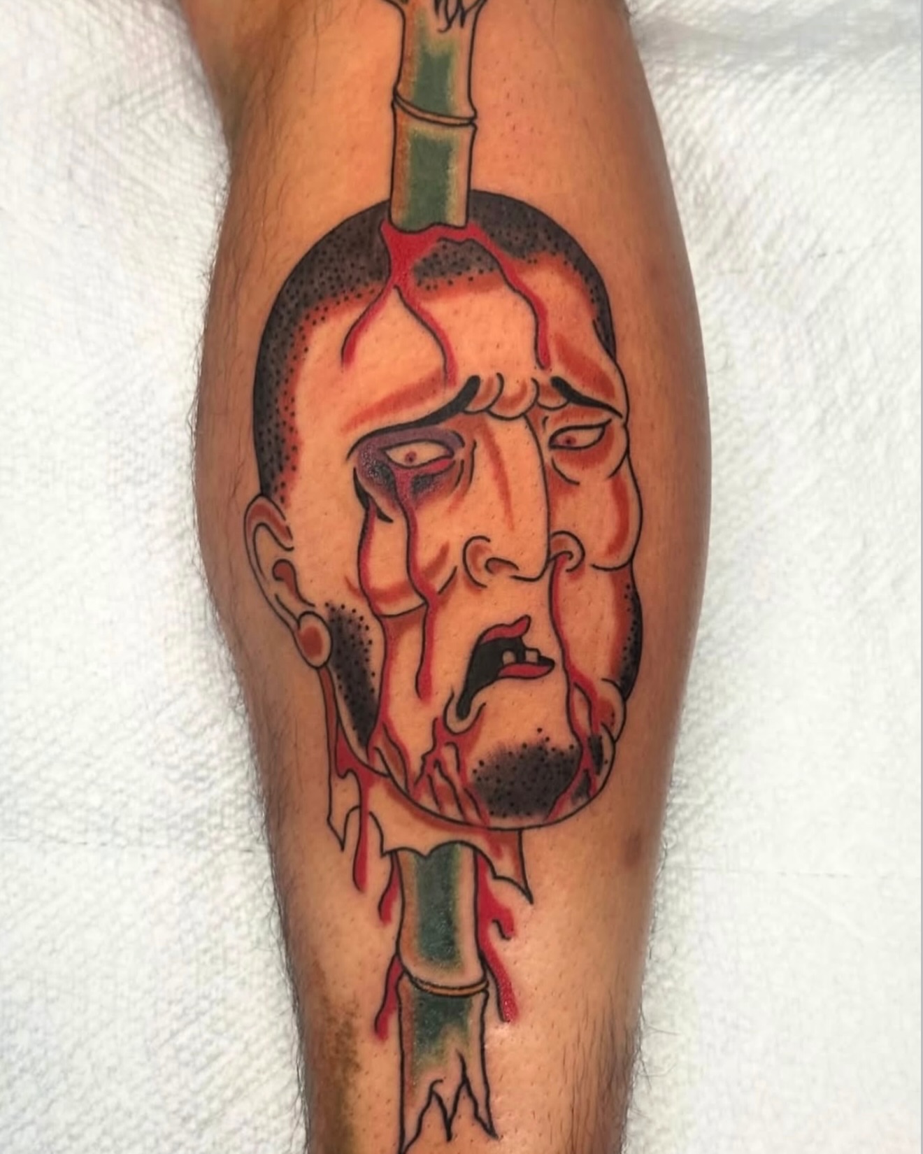 Man's head with blood American traditional tattoo on the forearm by 🕸🎚 𝑺𝑨𝑵𝑻𝑰 𝑺𝑬𝑽𝑬𝑵𝑺 🎚🕸🇫🇯