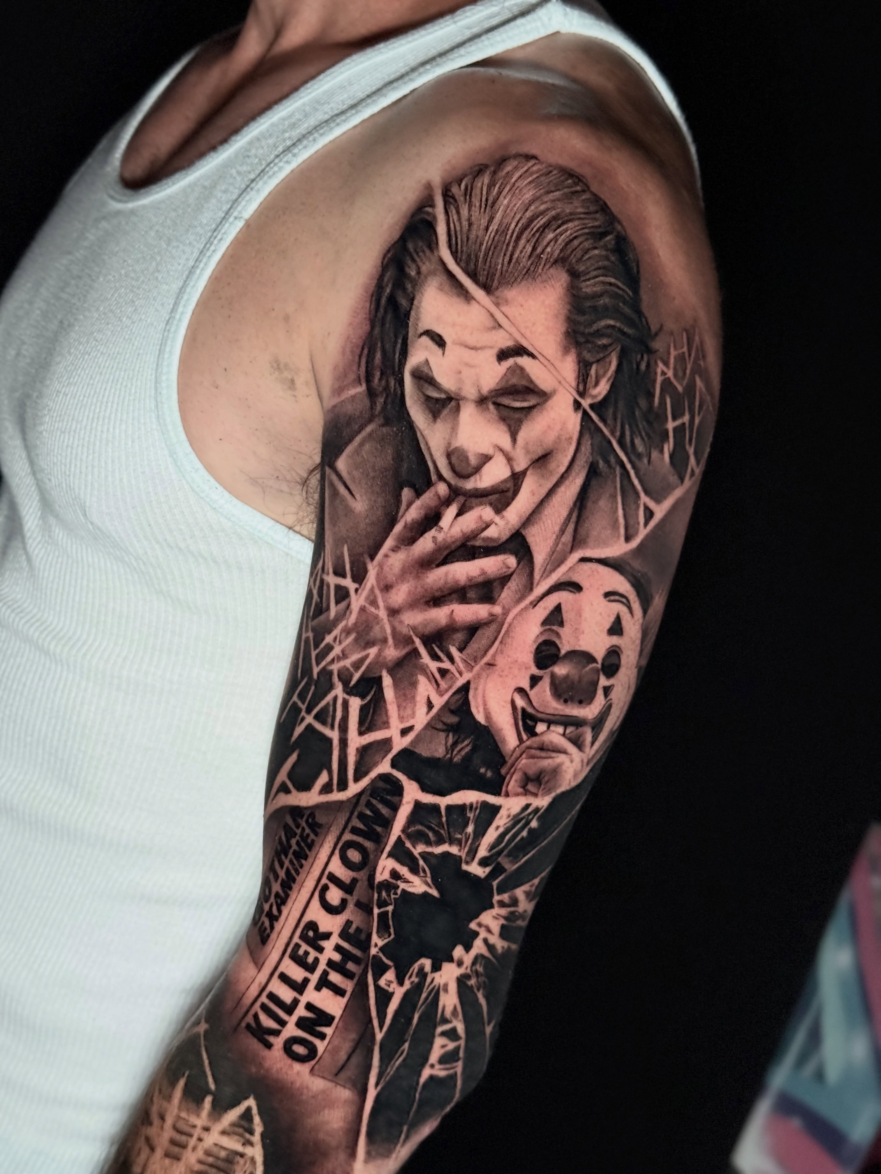 Joker realism tattoo on the upper arm by Gilberto Flores Nava