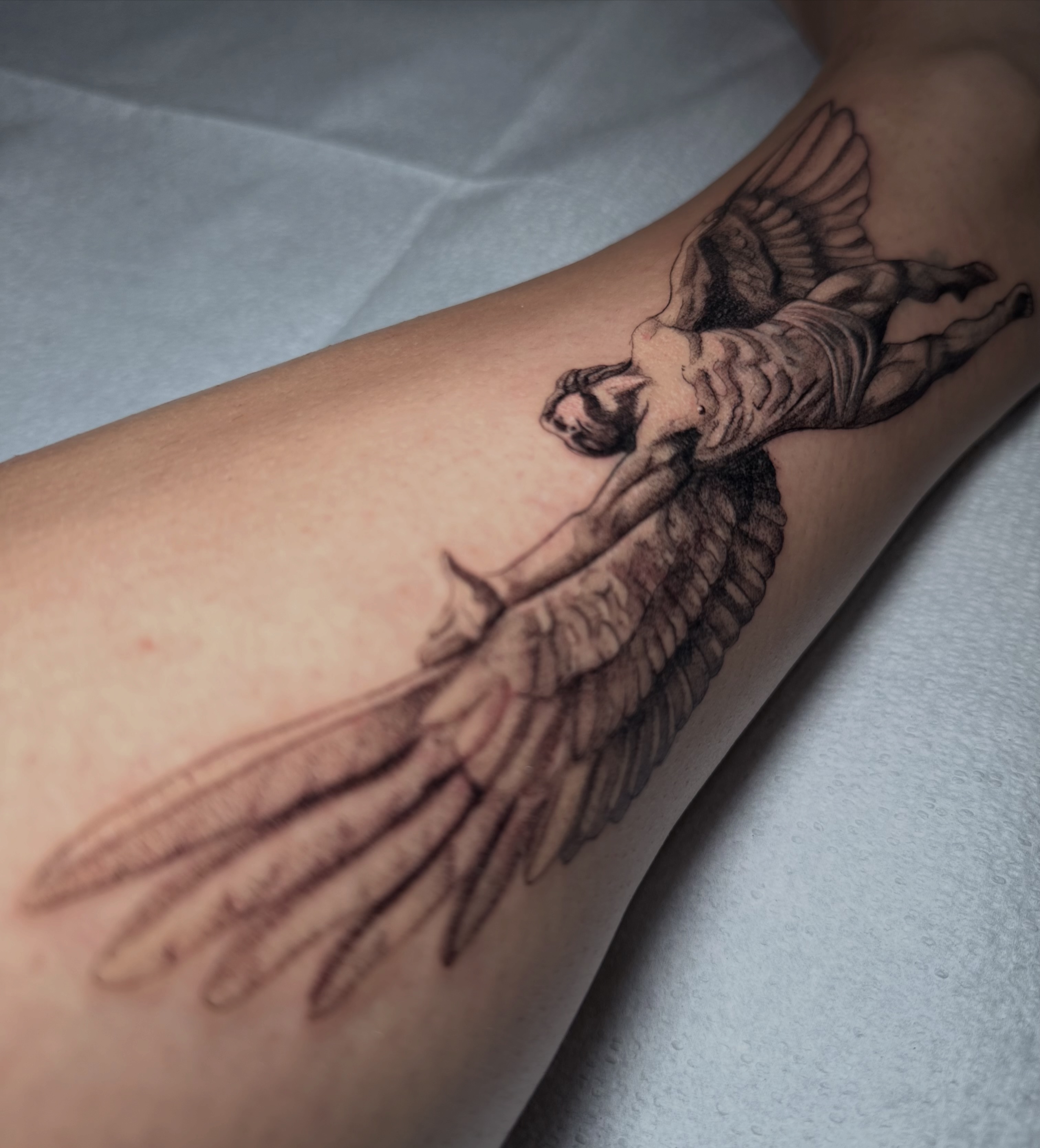 Angel realism tattoo on the forearm by Fabian Hellberg