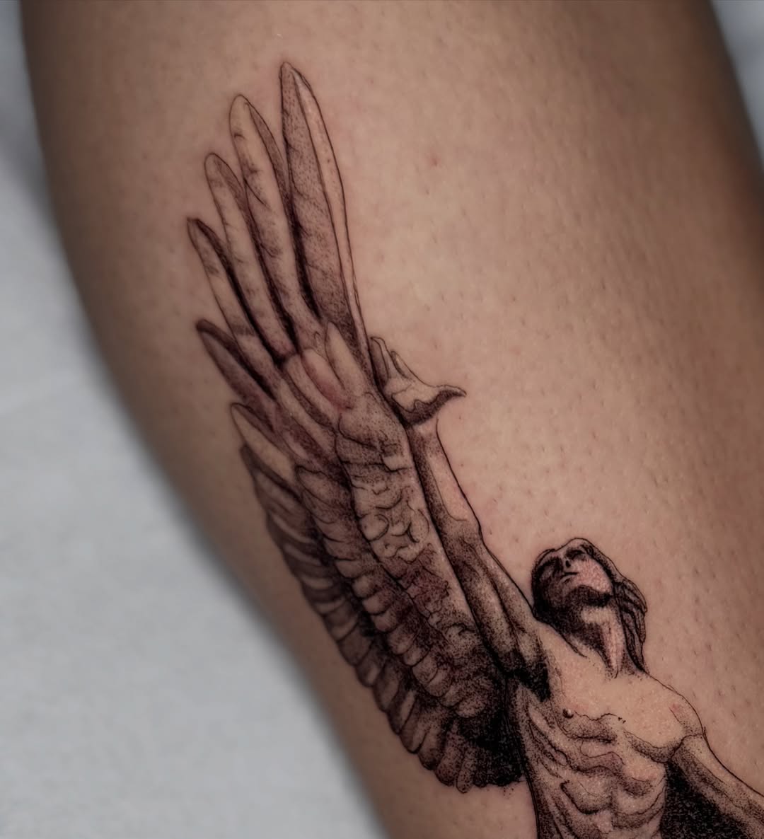 Angel with wings black and grey tattoo on the forearm by Fabian Hellberg