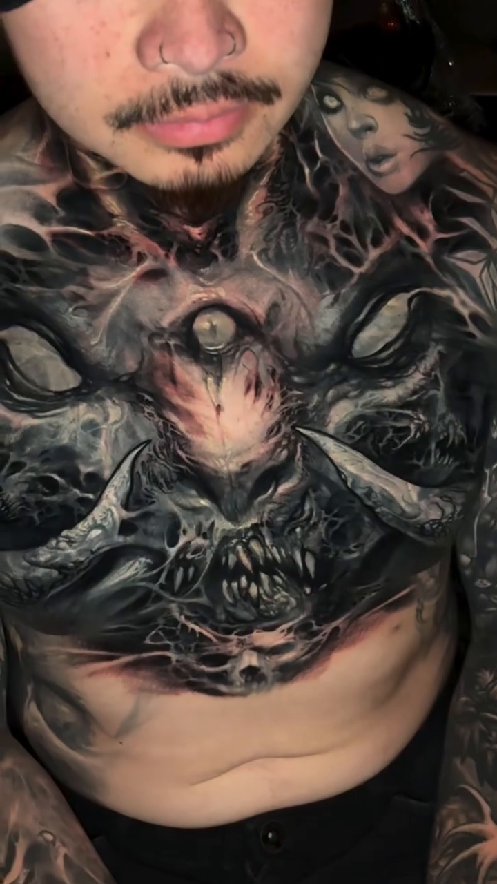 Demonic creature with multiple eyes dark realism tattoo by David Jorquera