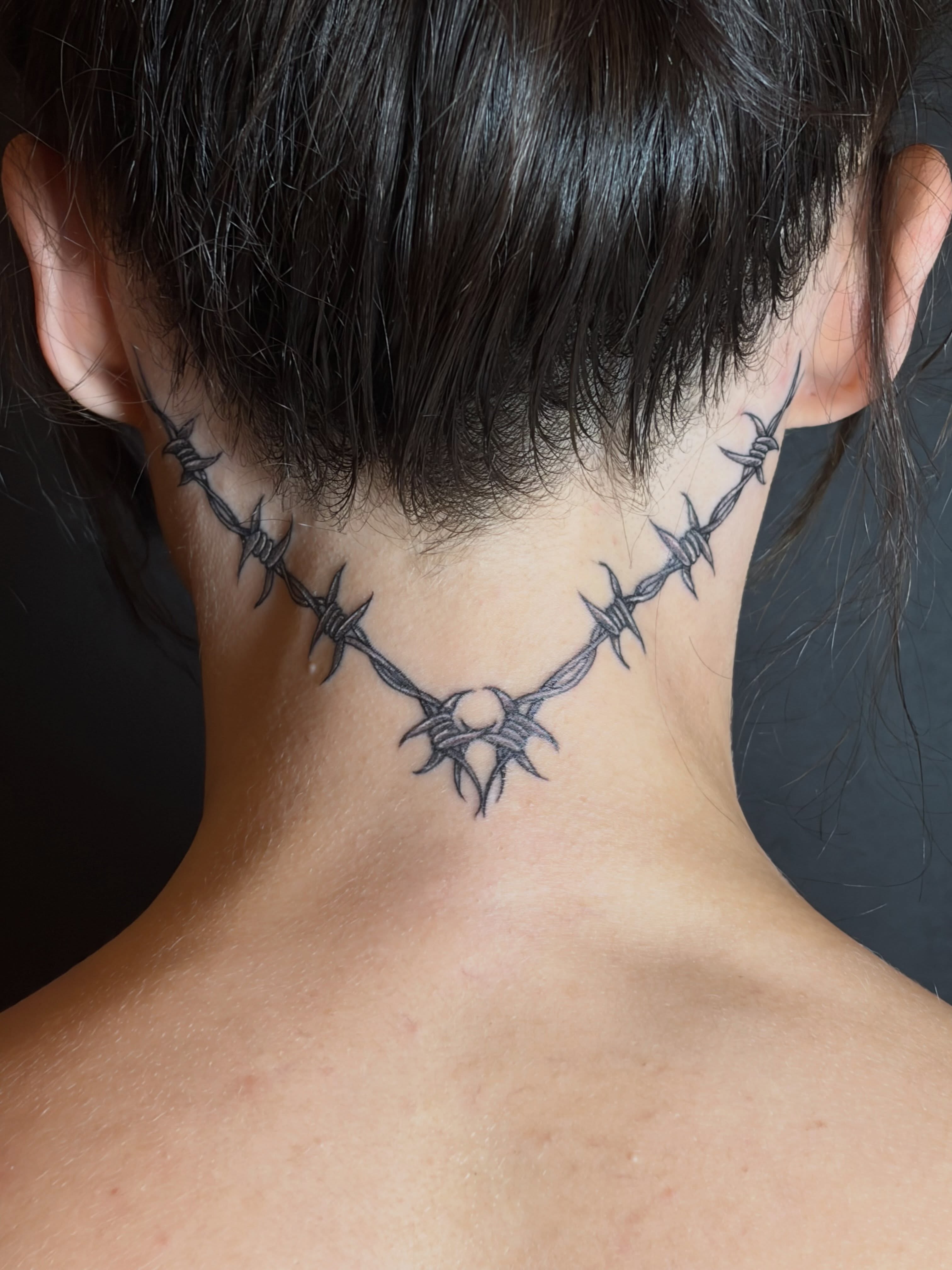 Barbed wire black and grey tattoo on the neck by Dont Worry About It