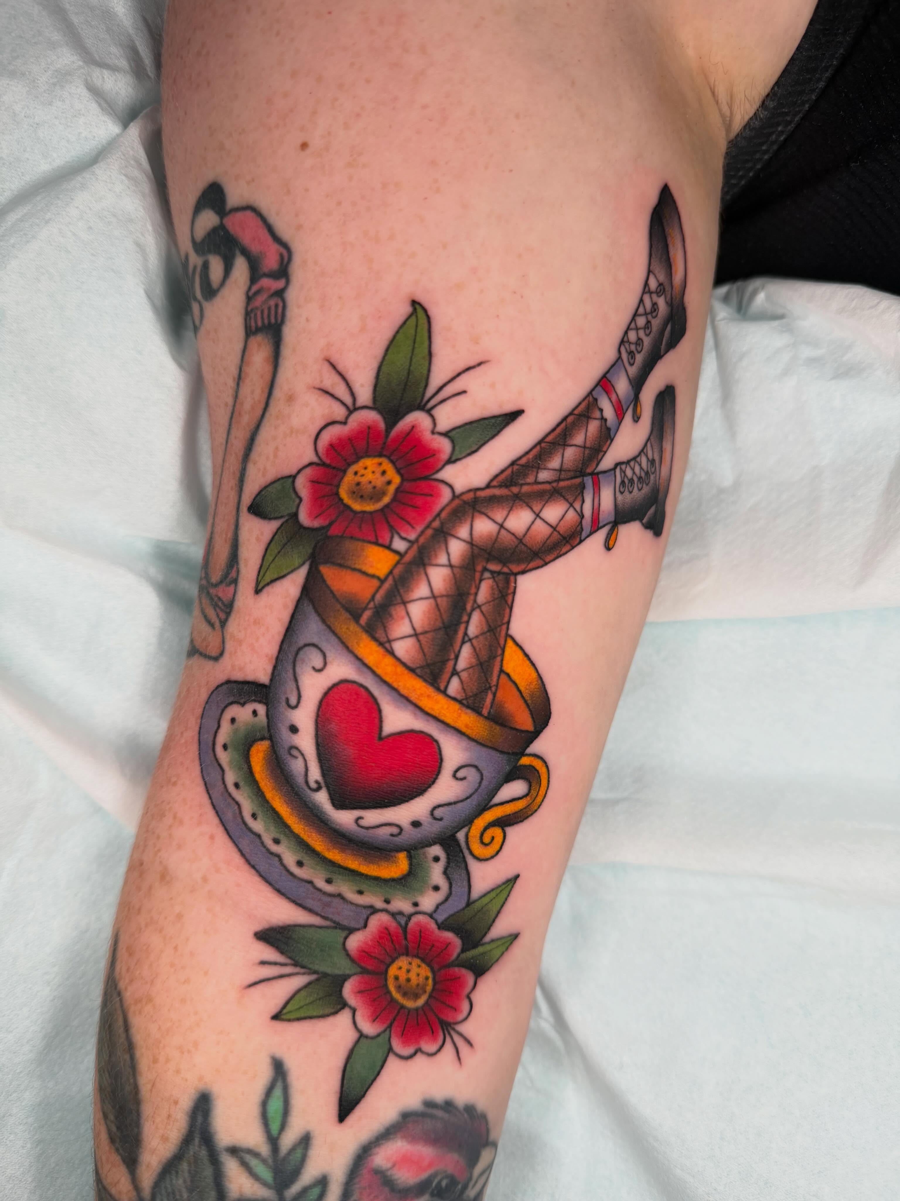Teacup and flowers American traditional tattoo on the forearm by ♥︎ ᴅᴇᴠ ʀᴇɴᴇᴇ ♥︎