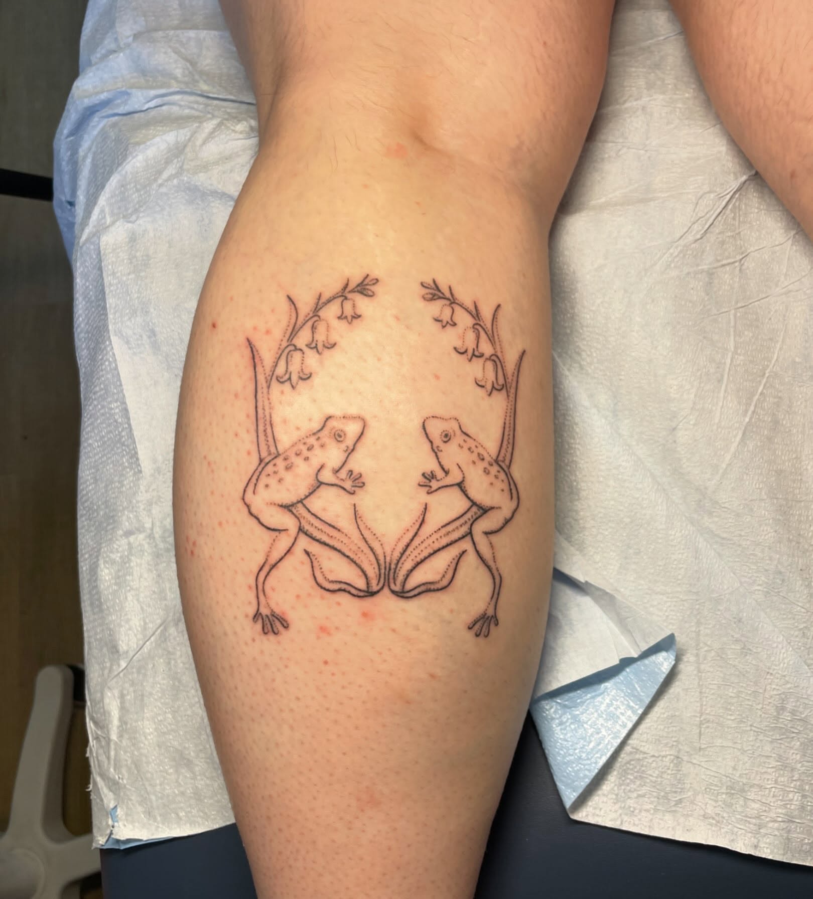 Frogs dotwork tattoo on the forearm by Quin