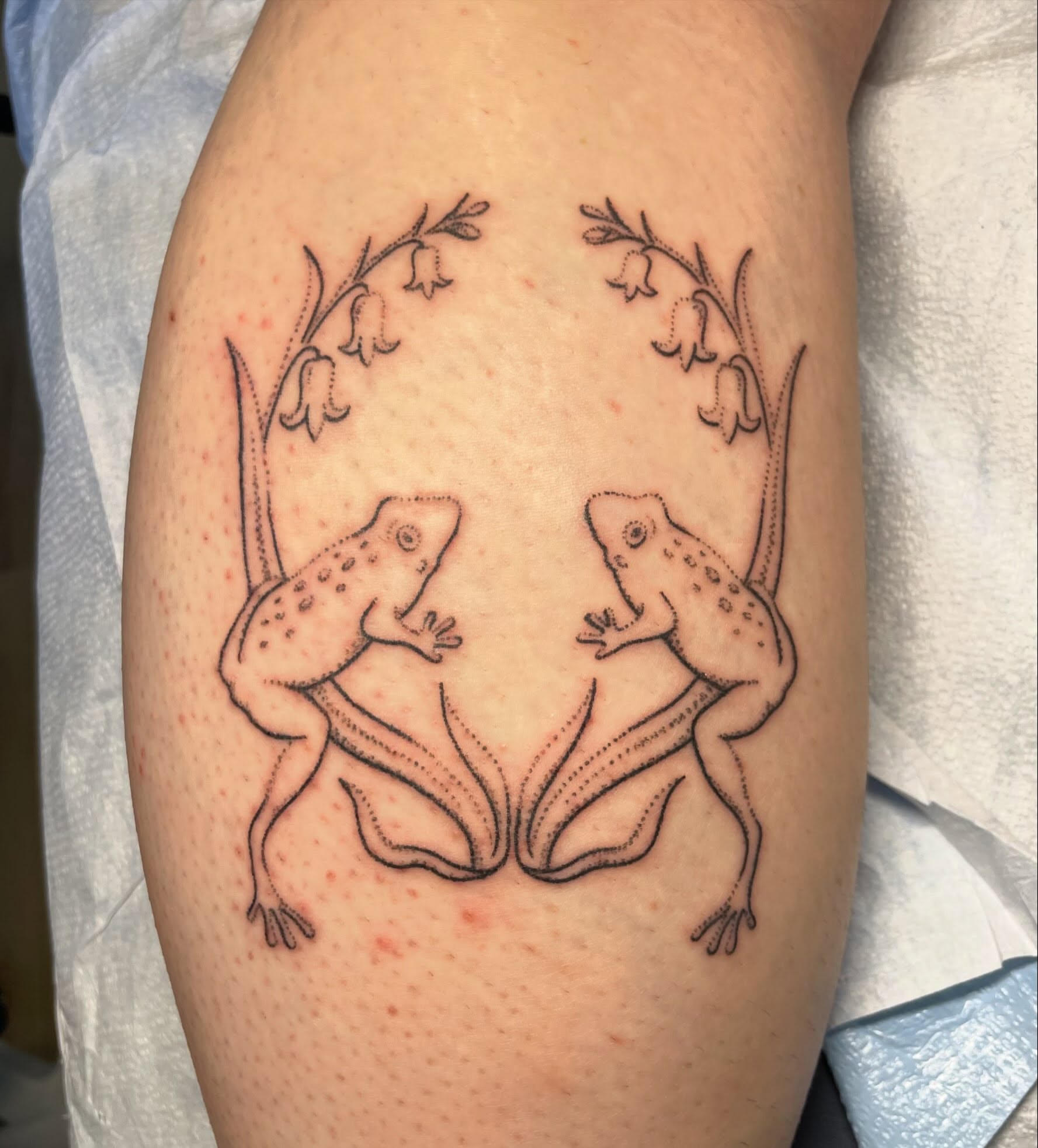 Frogs dotwork tattoo on the thigh by Quin
