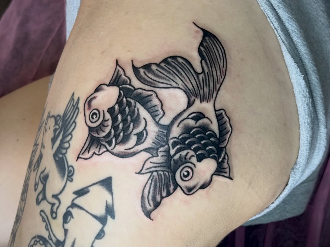 Koi fish American traditional tattoo on the thigh by Erica Mirella