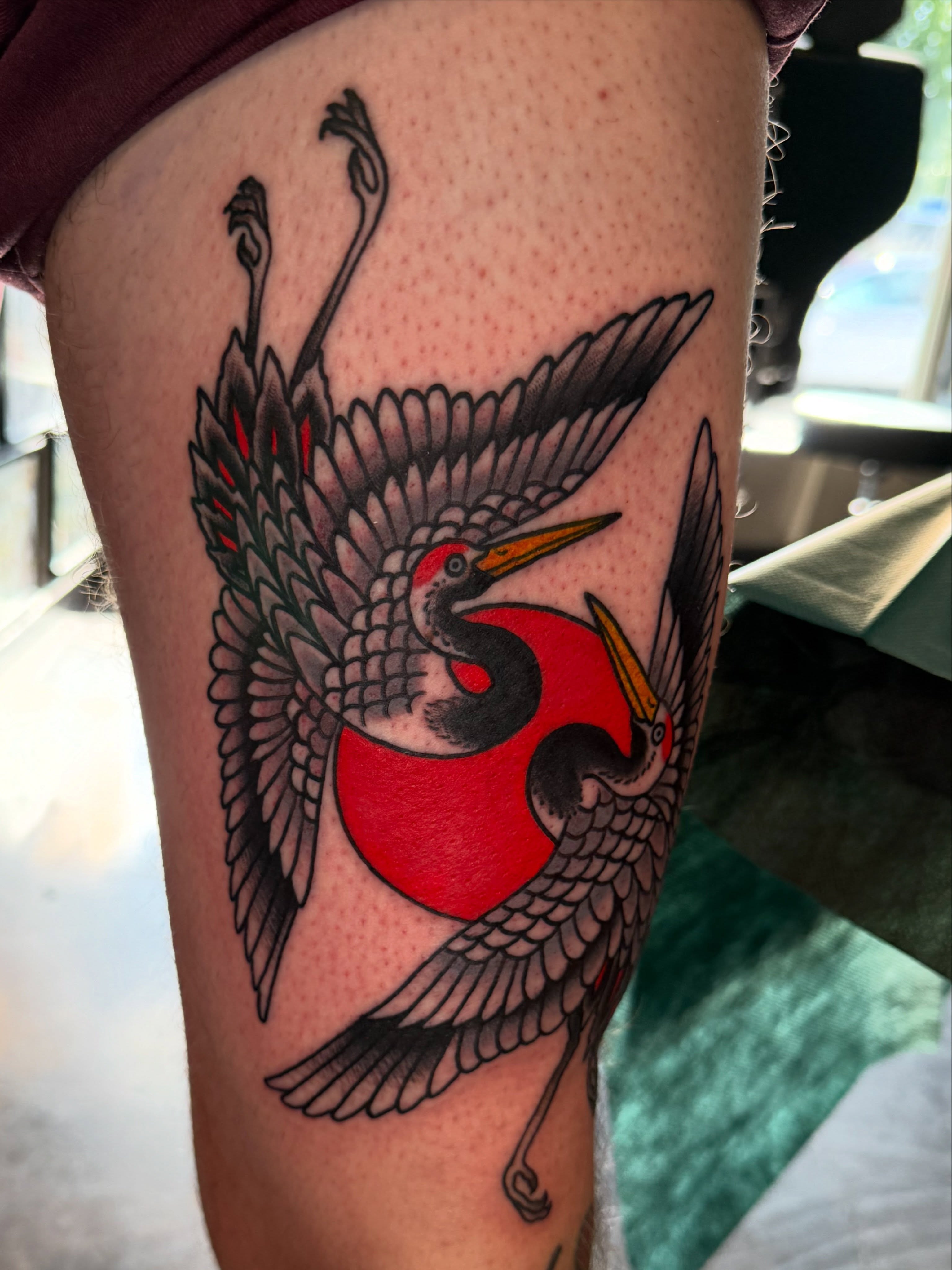 Cranes American traditional tattoo on the thigh by Christopher Mikesell