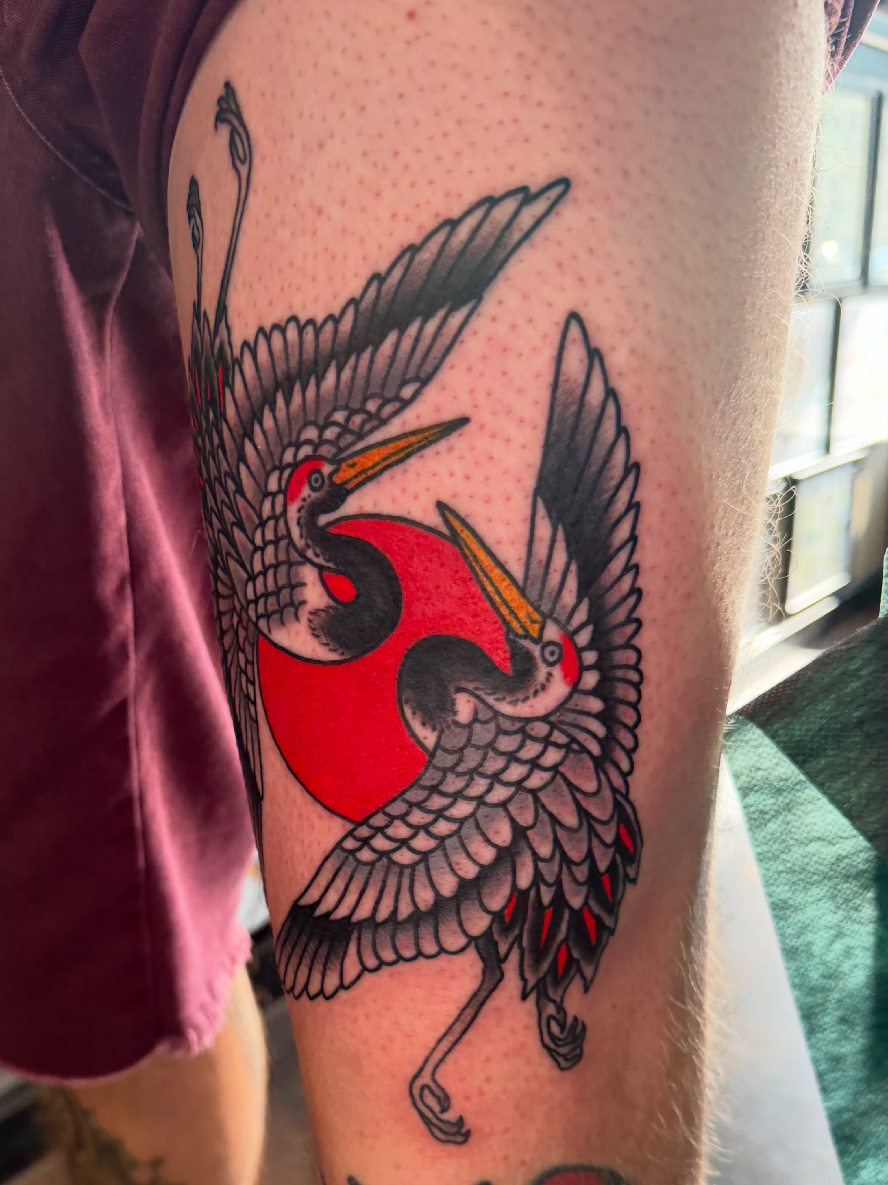 Cranes American traditional tattoo on the forearm by Christopher Mikesell