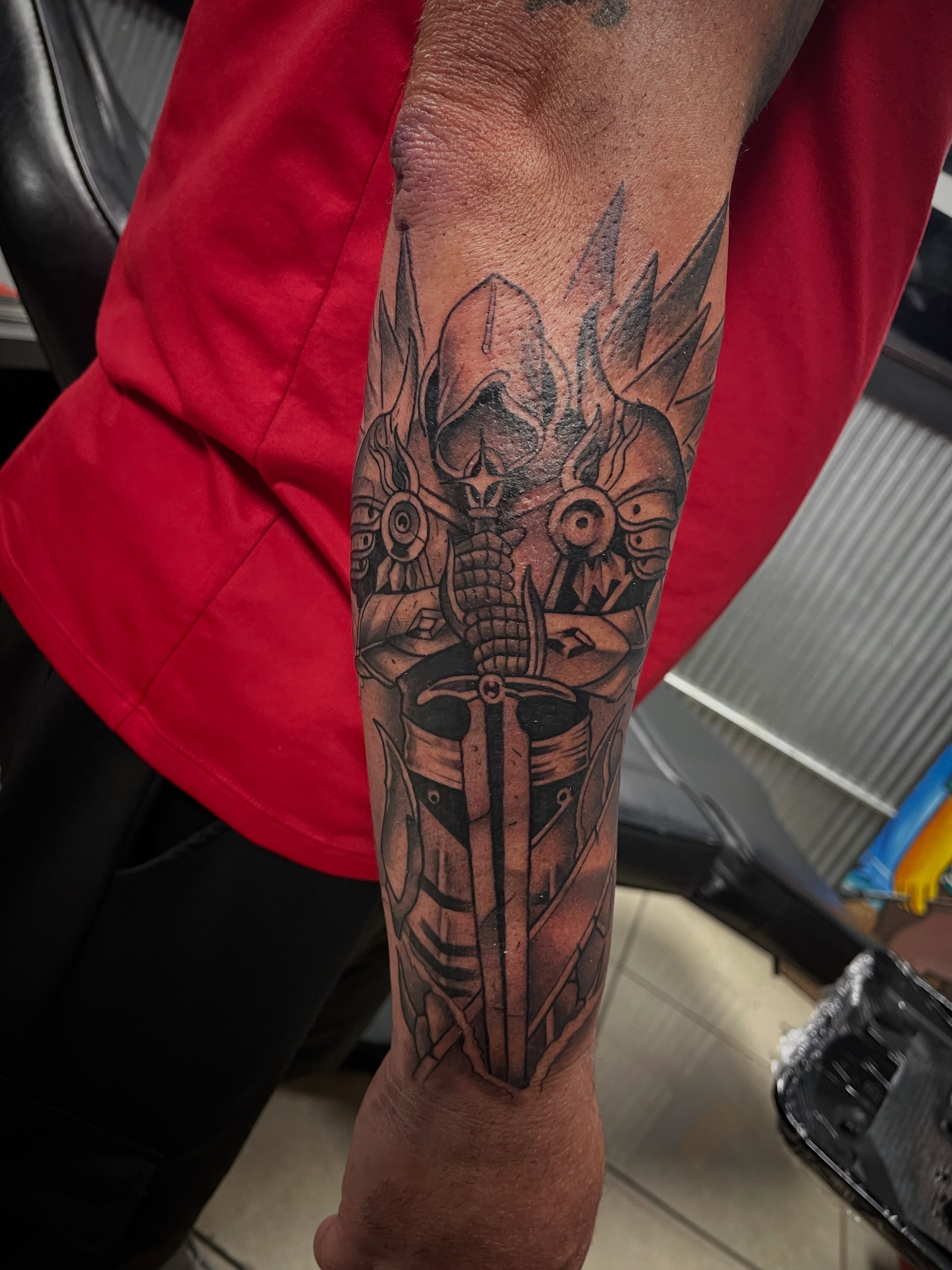 Mecha warrior geometric tattoo on the forearm by Chris Torres