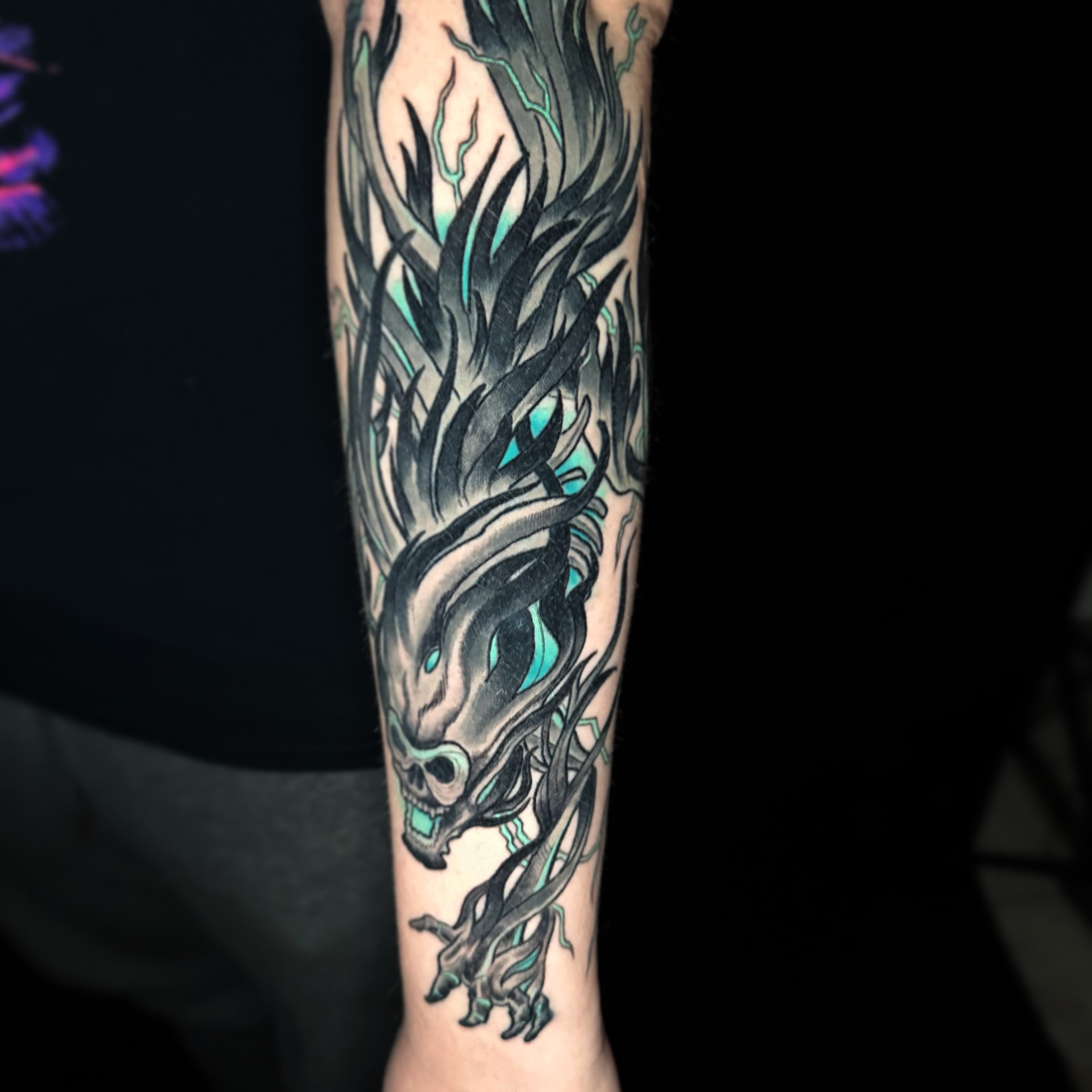 Skull and dragon japanese irezumi tattoo on the forearm by John Milosh Chamberlin