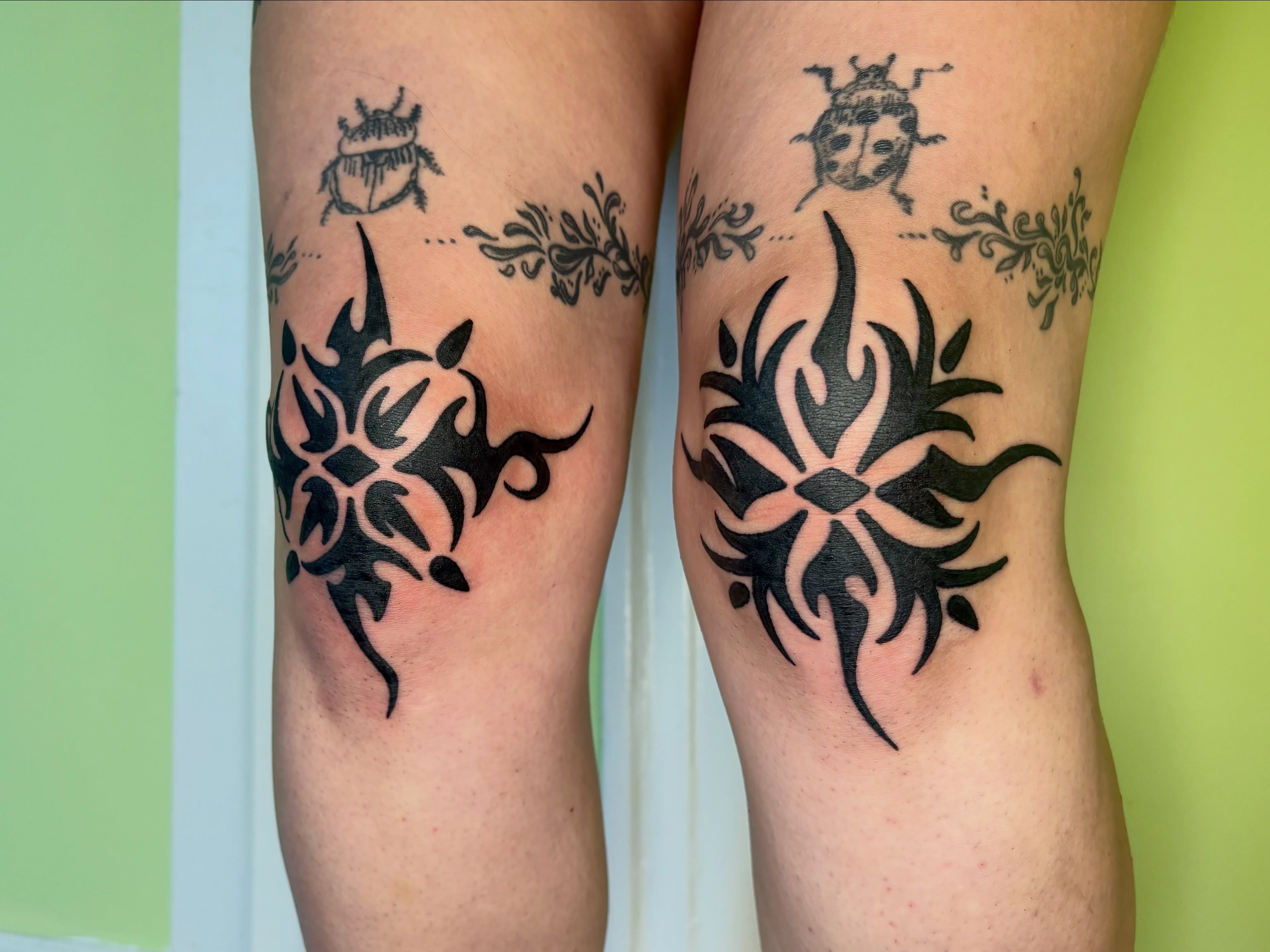 Tribal flame tribal tattoo on the leg by Grae