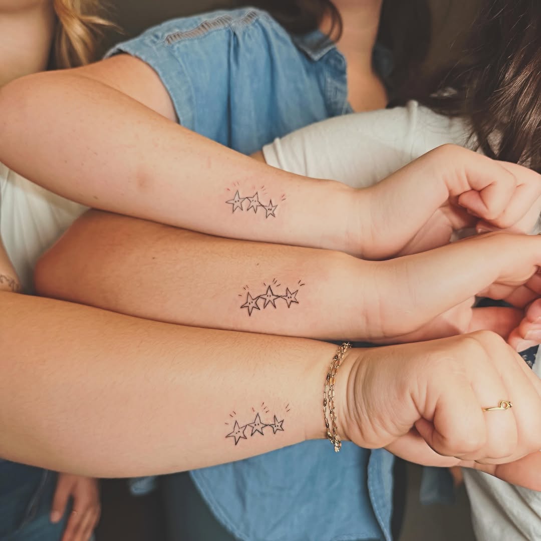 Stars minimalist tattoo on the forearm by Ashlee Burkey