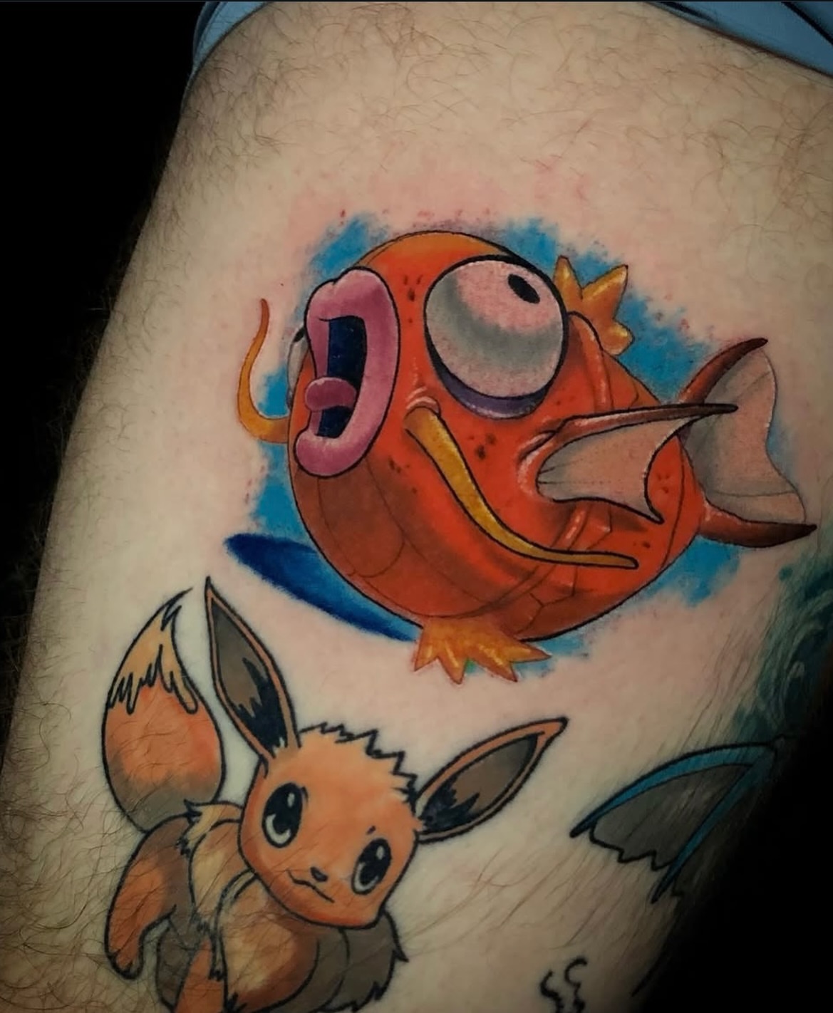Fish and eevee new school tattoo on the thigh by Frank Miller