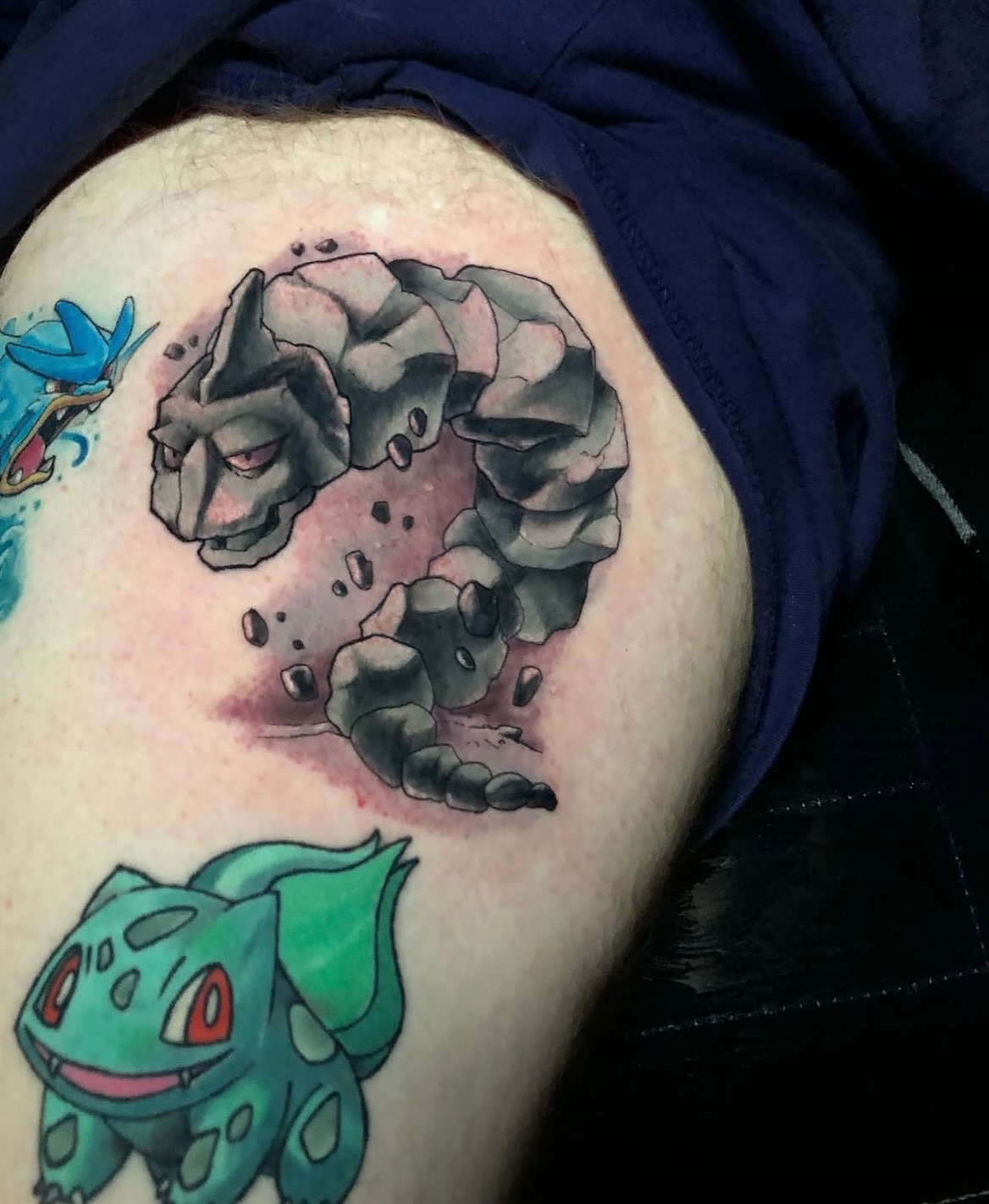 Rock creature realism tattoo on the thigh by Frank Miller