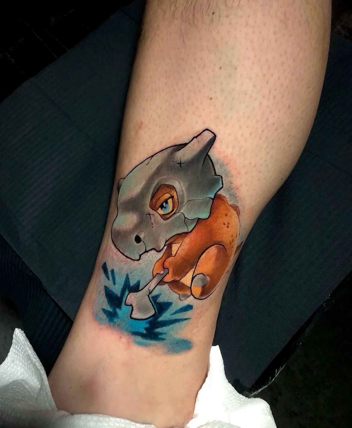 Dinosaur dotwork tattoo on the forearm by Frank Miller