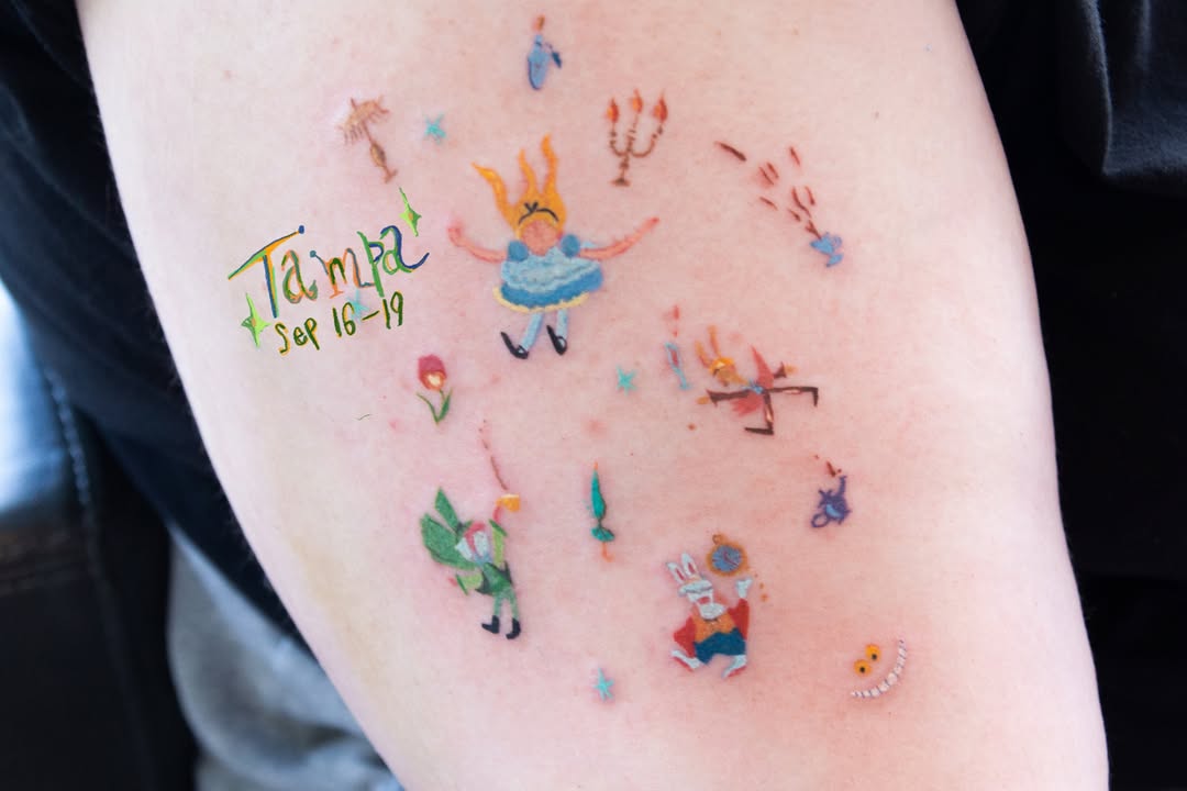 Alice in Wonderland characters new school tattoo on the forearm by Ki