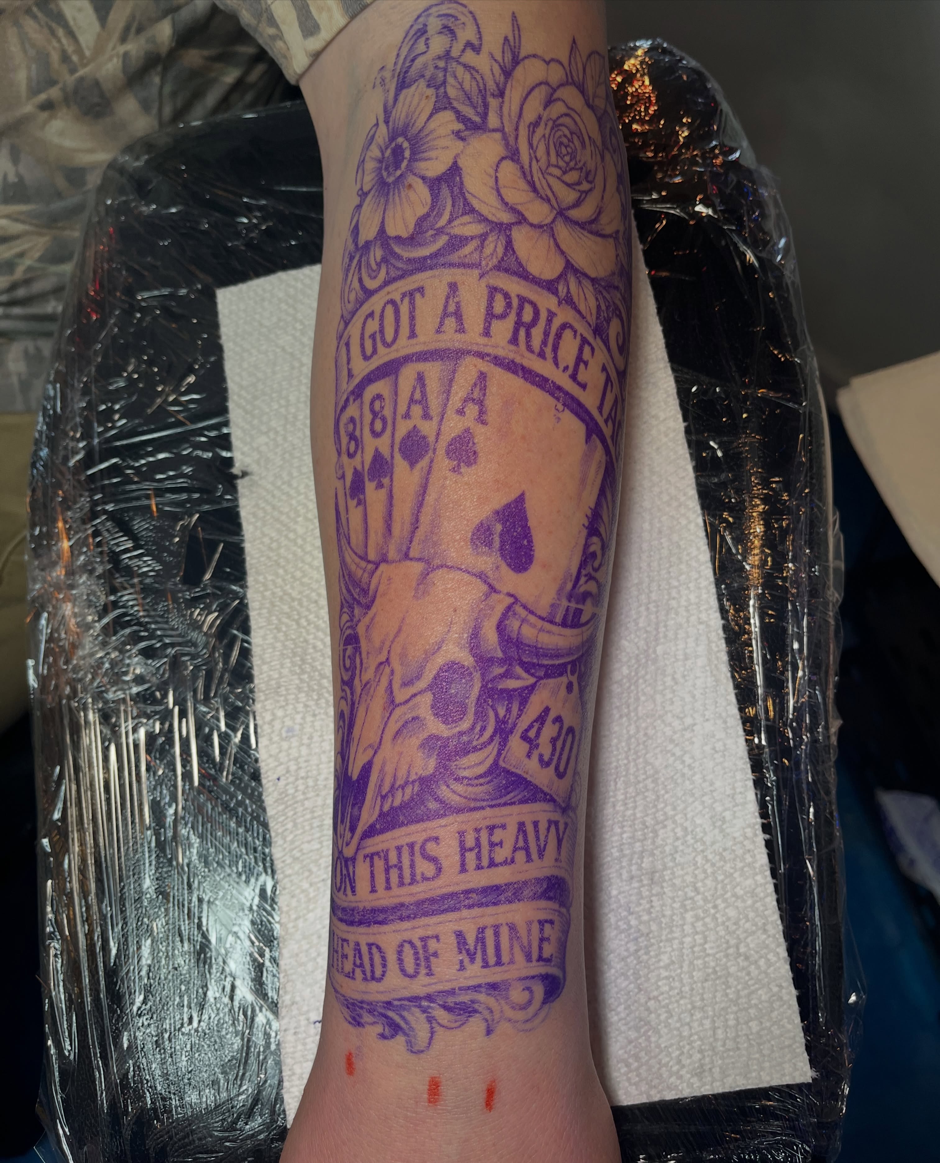 Playing cards and skull American traditional tattoo on the forearm by Blue Horseshoe Tattoo & Body Piercing