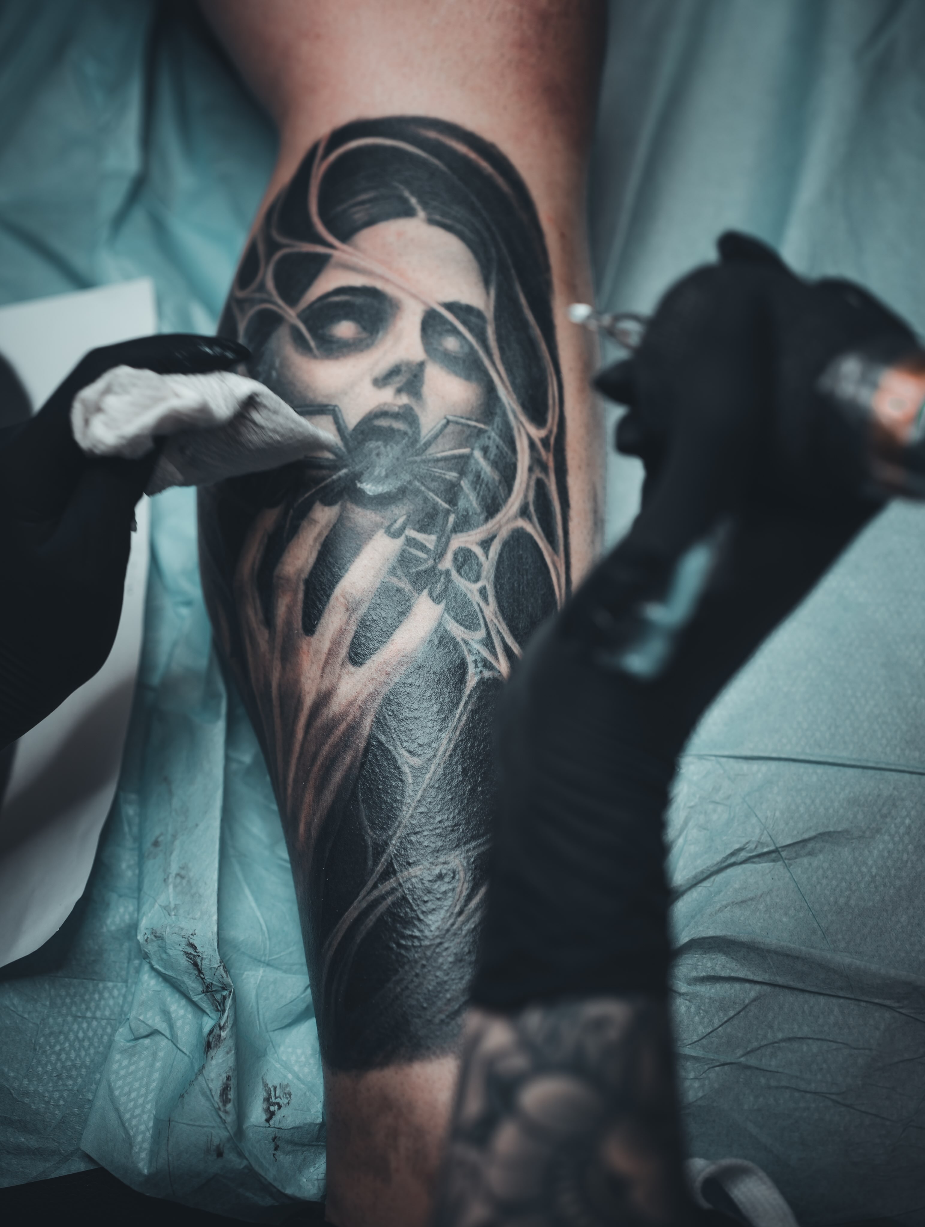 Woman with spider dark realism tattoo on the forearm by Andres Flores
