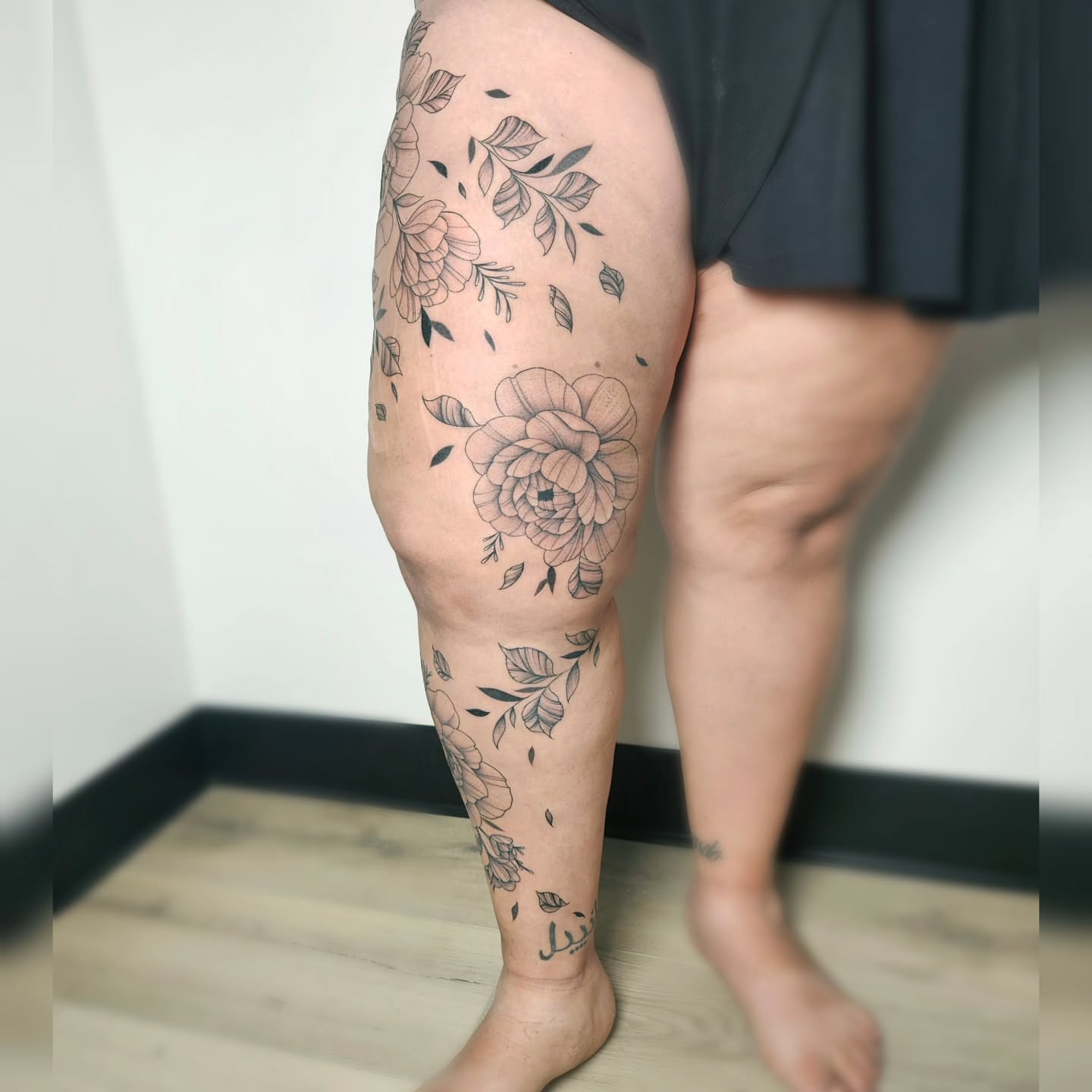 Floral design black and grey tattoo on the thigh by TaylorLeighShermanTattoos OFFICIAL