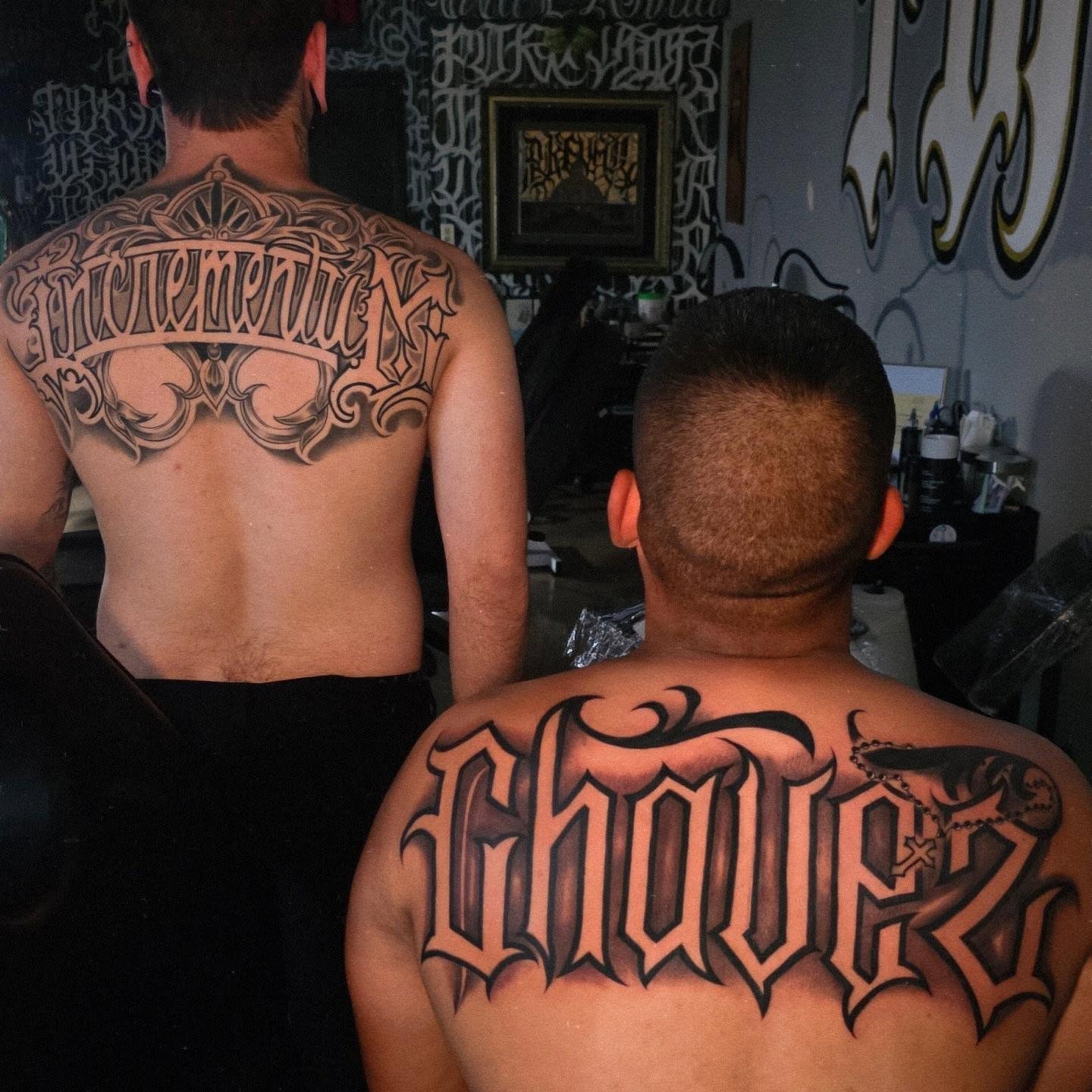 Script lettering lettering script tattoo on the back by Tattoo Seez, Wichita, Kansas